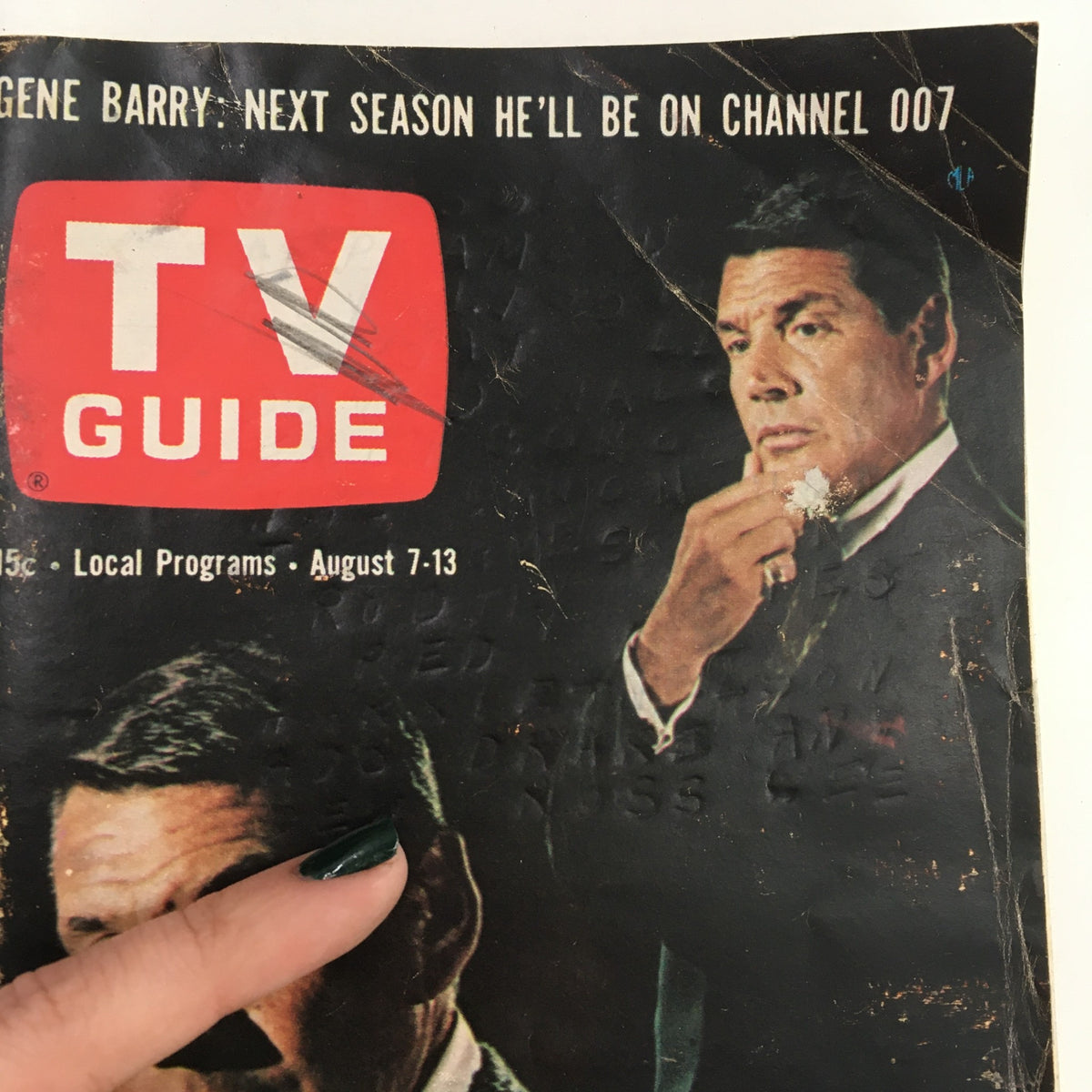 Close-up view of the TV Guide Magazine cover from August 7, 1965, showcasing Gene Barry and promotional text for upcoming programs.