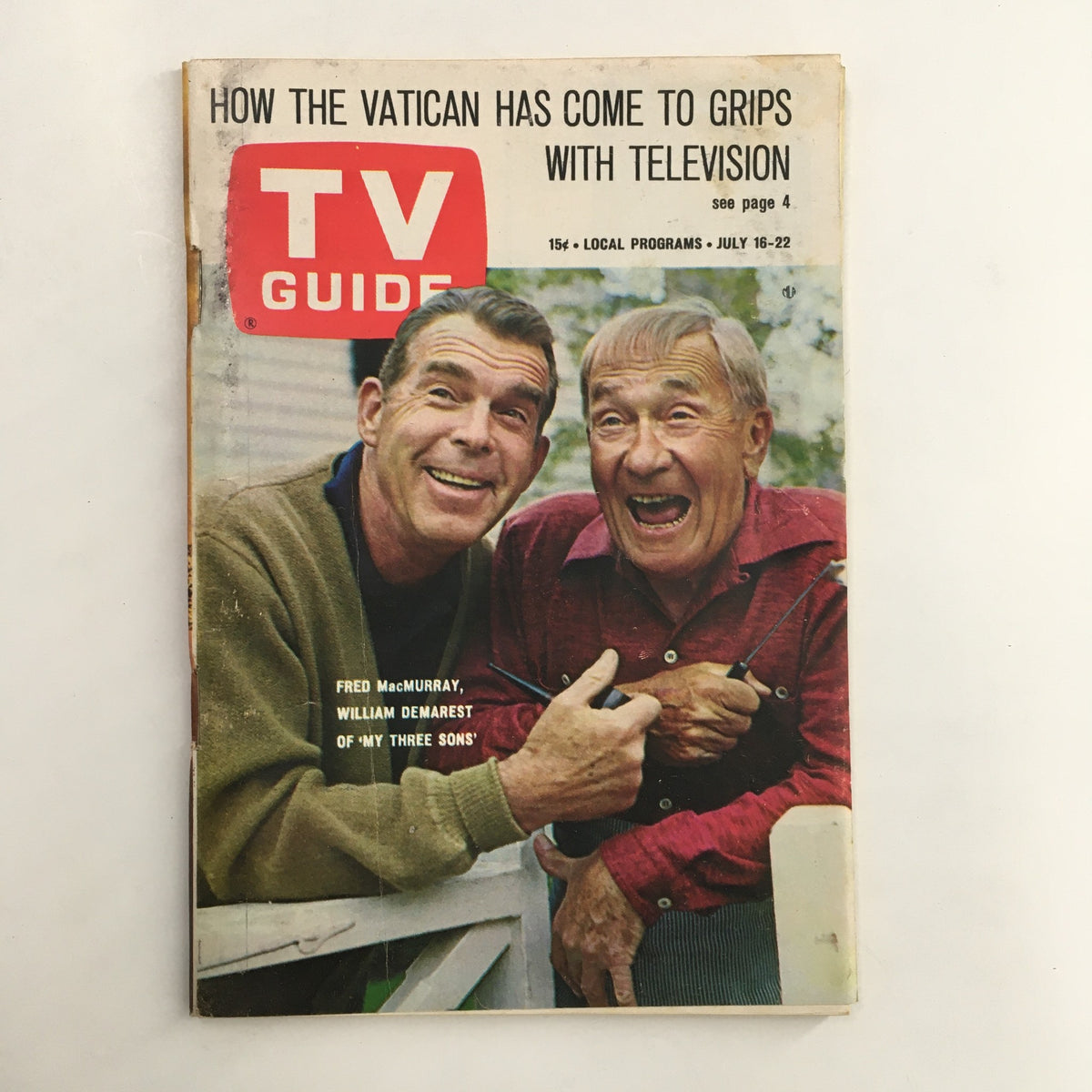 Cover of TV Guide Magazine July 16 1966 featuring Fred MacMurray and William Demarest from 'My Three Sons'. Highlights vintage television history.