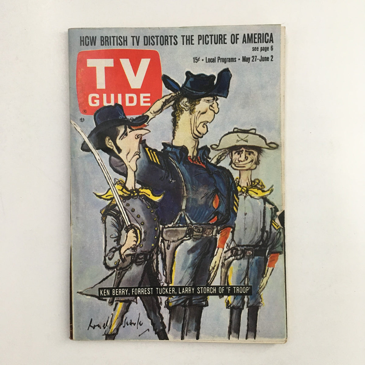 TV Guide dated May 27, 1967, featuring Ken Berry, Forrest Tucker, and Larry Storch from the show 'F Troop'. The vintage magazine cover illustrates a playful cartoon style with characters in military attire, showcasing a nostalgic glimpse into television history.