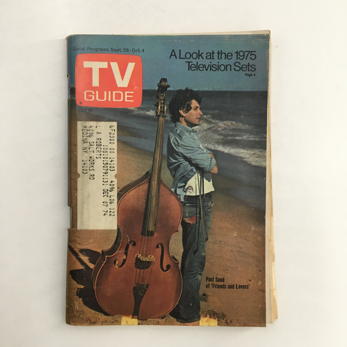 TV Guide September 28 1974 featuring cover art of Paul Sand by Ivan Nagy, highlighting a vintage magazine aesthetic with a scenic beach background and a prominent double bass instrument.