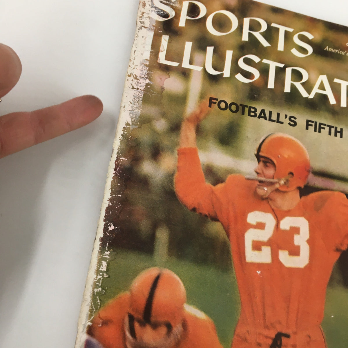 Close-up of the cover of VTG Sports Illustrated Magazine October 27 1958 showing details of Football's Fifth Week with player number 23.