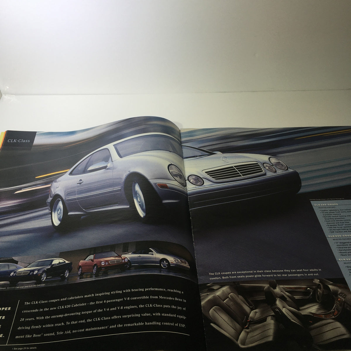 2000 Mercedes-Benz CLK-Class S-Class Dealership Catalog Brochure showcasing the CLK-Class model in motion, highlighting its sleek design and luxury performance.