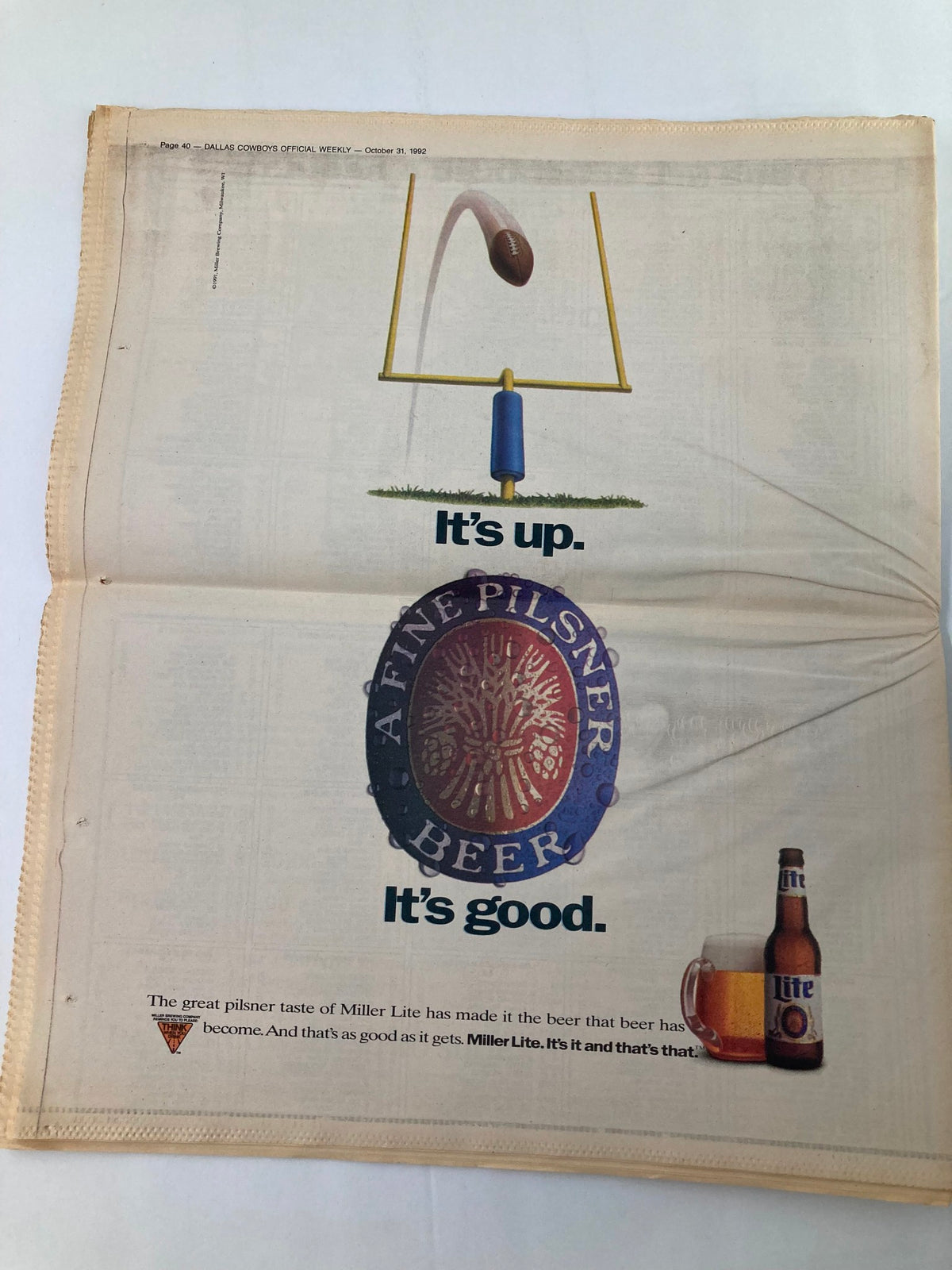 Dallas Cowboys Weekly Newspaper October 31 1992 featuring an advertisement for Miller Lite, placed among the sports content, highlighting the beer's recognition during the NFL season.