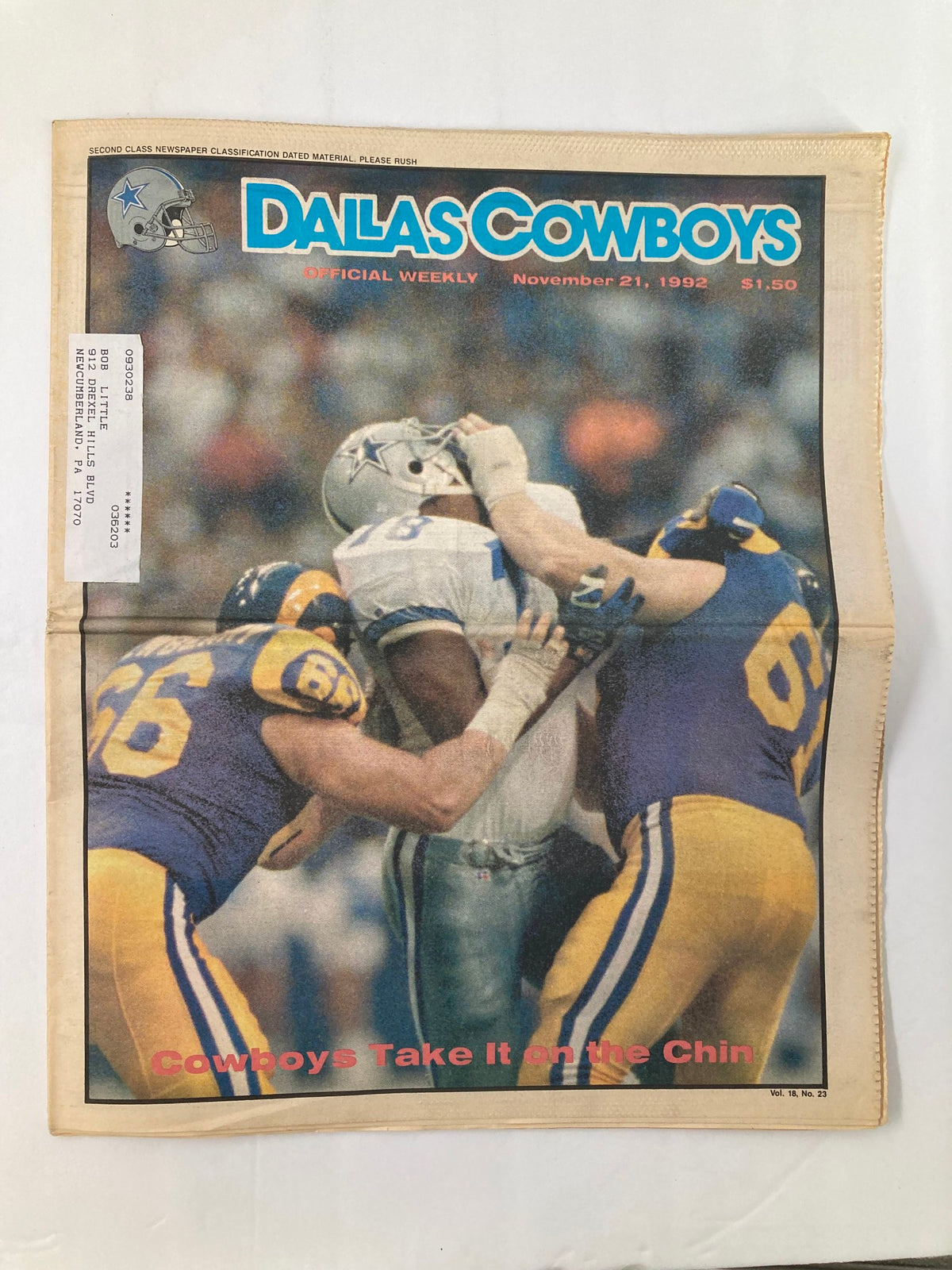 Dallas Cowboys Weekly Newspaper November 21 1992 featuring a dramatic cover image of players during a game, showcasing the title 'Cowboys Take It on the Chin'. The newspaper is in good condition with a label on the front.