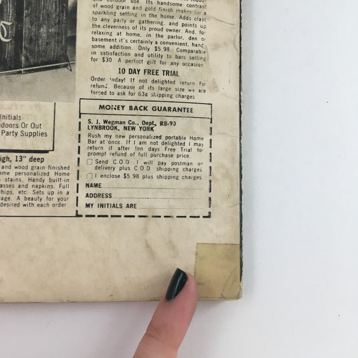 Back cover of The Original Science Fiction Stories March 1959 Project Starlight Novel showing advertisements and details about the home bar product with a person's finger pointing at the text.