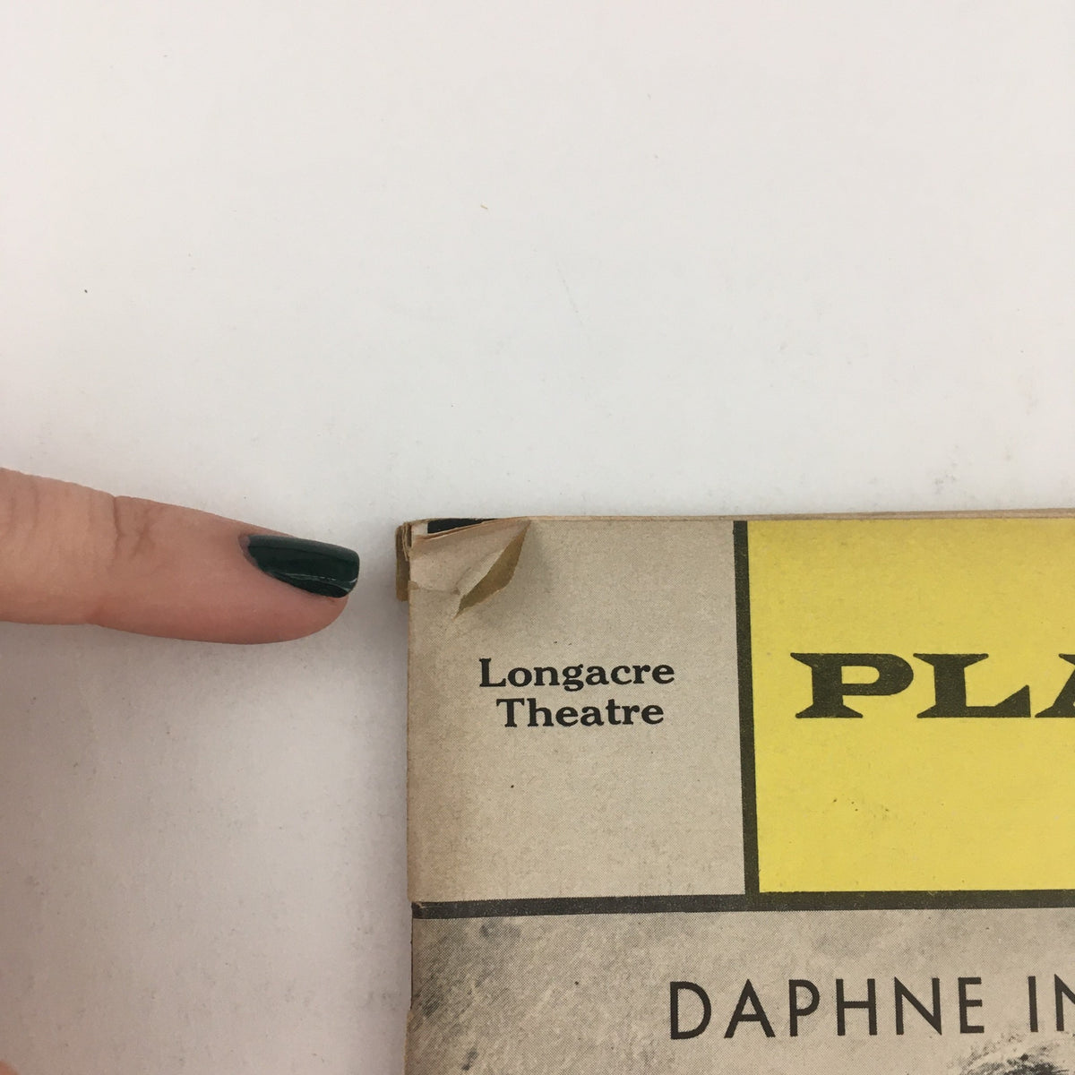 Close-up view of the 1967 Playbill for 'Daphne In Cottage D' at Longacre Theatre, highlighting the 'PL' in the title, reflecting its vintage condition.
