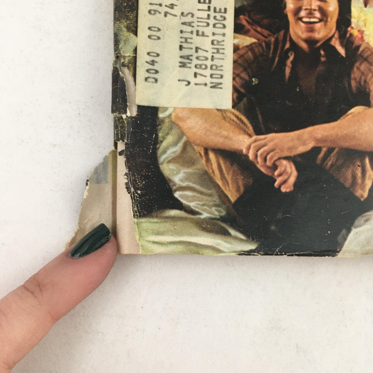 Close-up of the side of the TV Guide January 4, 1969 issue, highlighting the address label and wear on the magazine, showcasing its unique history as a vintage collectible.