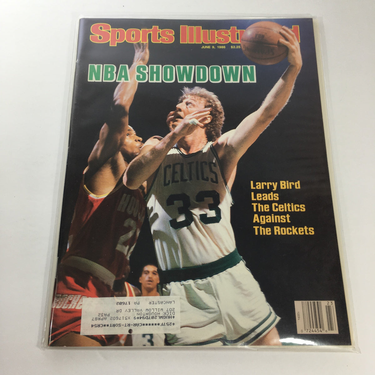 Sports Illustrated June 9, 1986 cover featuring NBA Showdown with Larry Bird leading the Boston Celtics against the Rockets, capturing a moment from basketball history.