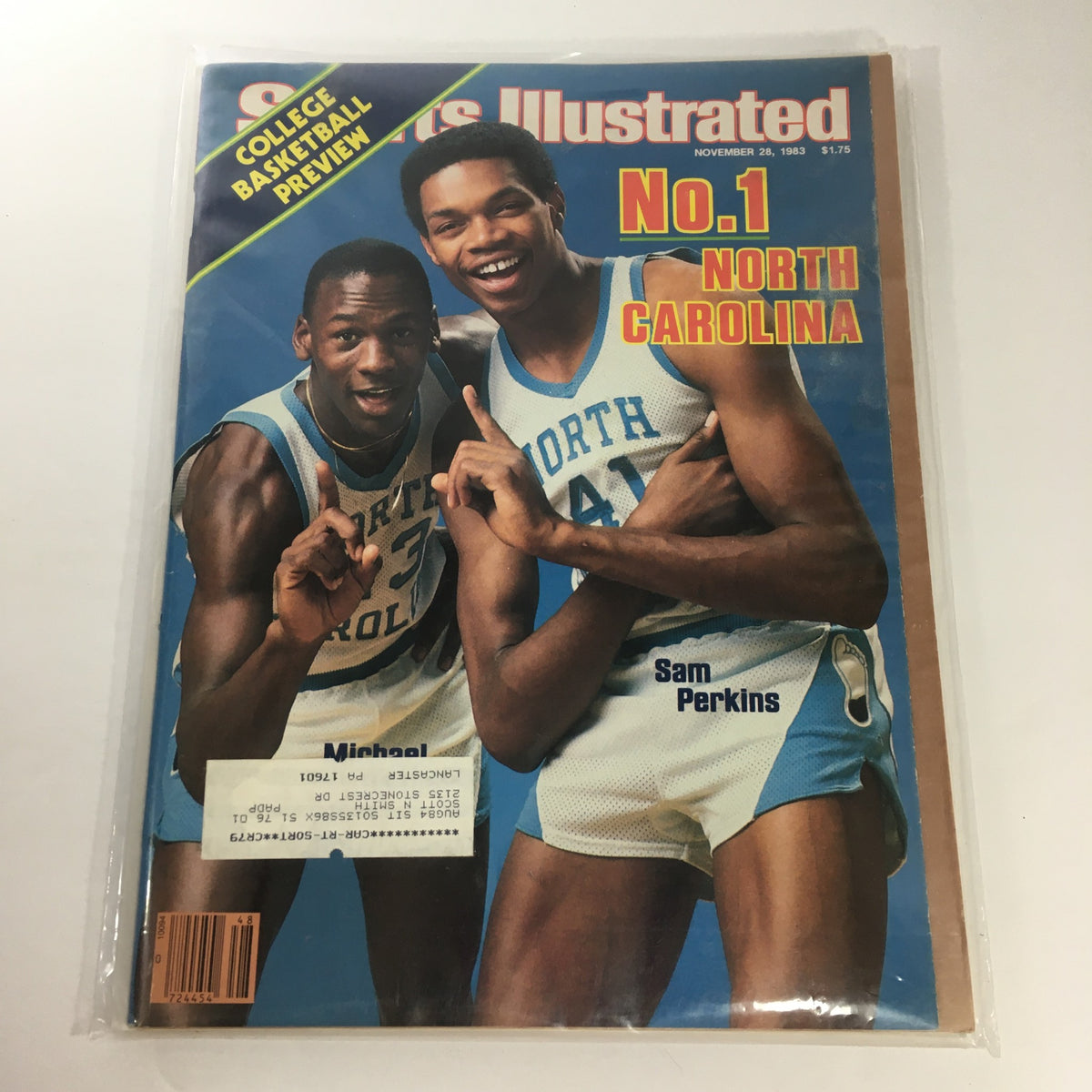 Sports Illustrated cover from November 28, 1983, featuring basketball players Michael Jordan and Sam Perkins, celebrating North Carolina's number one ranking in college basketball. This iconic vintage magazine is a collectible piece of sports history.