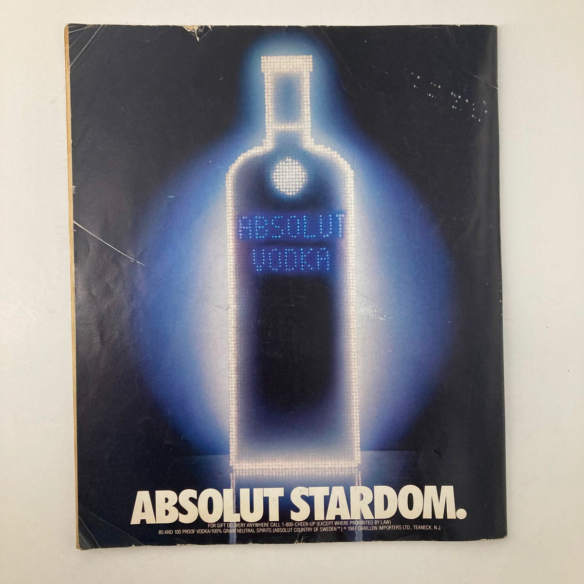 Vintage magazine cover: 'Absolut Stardom' featuring Absolut Vodka illuminated against a dark background. Relevant to the magazine titled 'VTG Memories Magazine of Then and Now October 1989 The Last Days of Al Capone'.