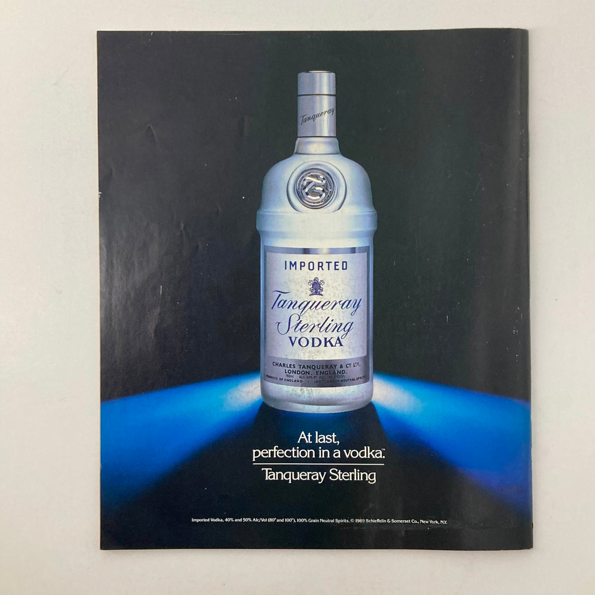Back cover of Memories Magazine of Then and Now, August 1990, featuring an advertisement for Tanqueray Sterling Vodka, emphasizing the product's quality and branding.