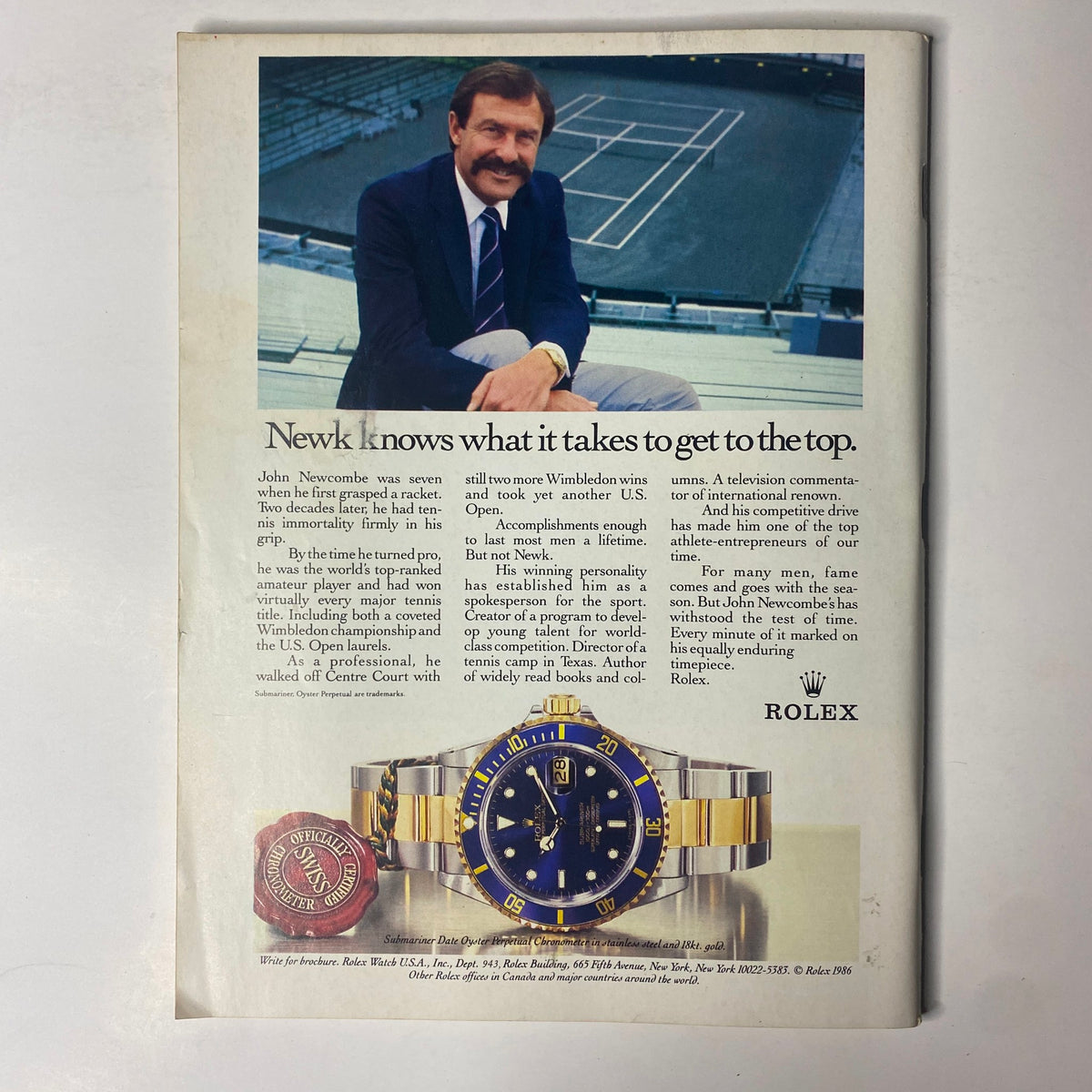 Back cover of Forbes Magazine August 25, 1986, featuring an advertisement for Rolex with a portrait of John Newcombe, a prominent tennis player.
