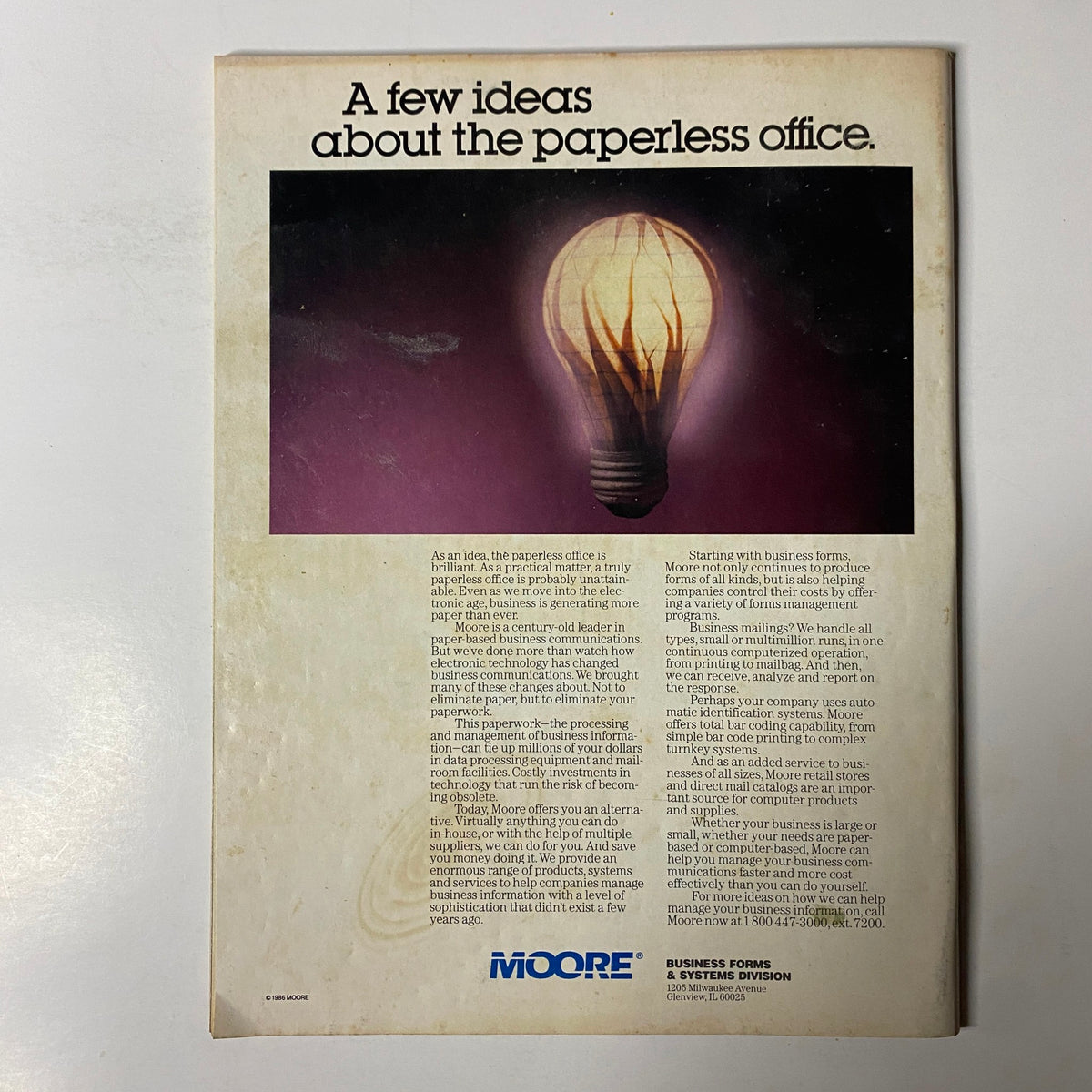 Back cover of Forbes Magazine July 14, 1986, highlighting the idea of a paperless office with a light bulb design, showcasing thoughts on electronic business communication.