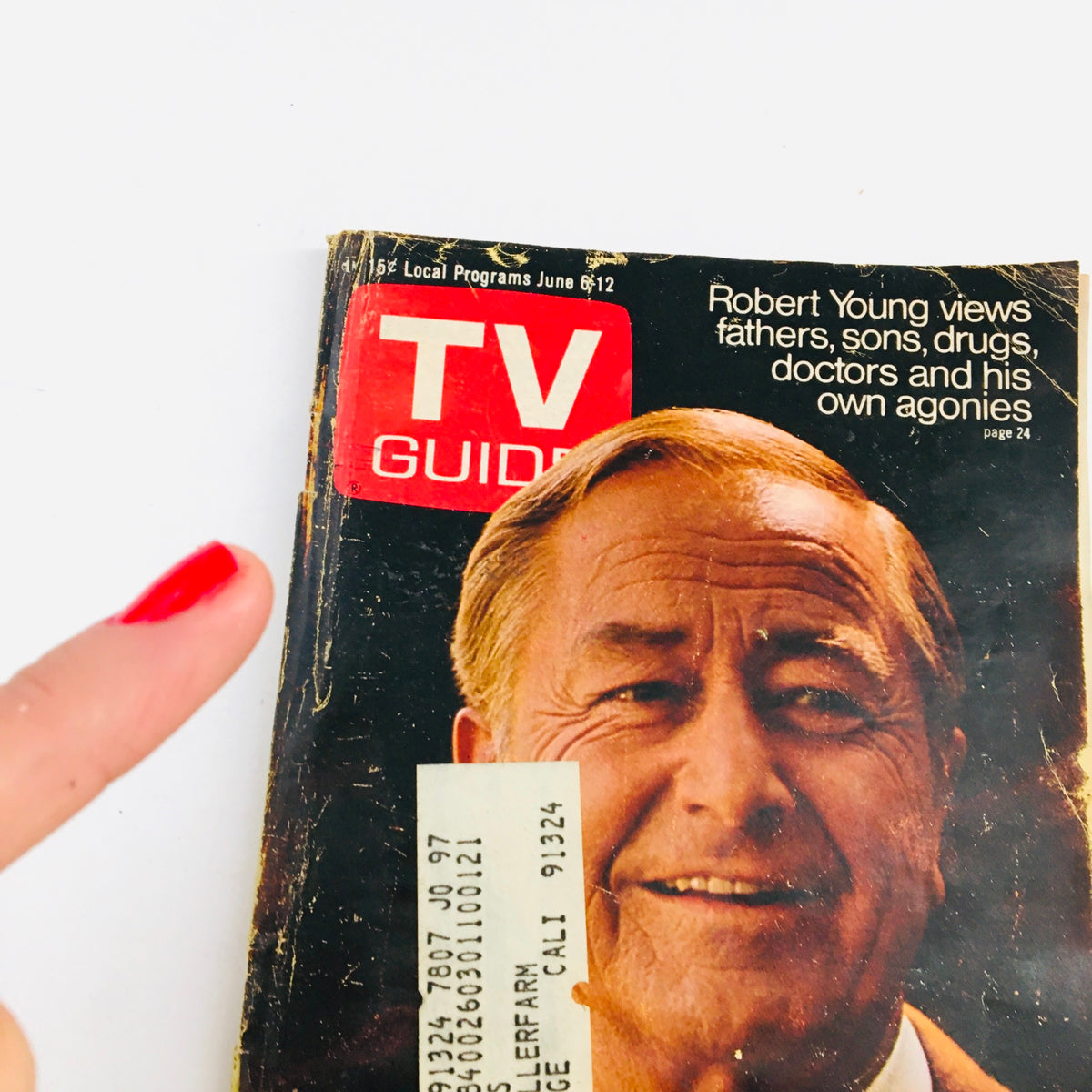 Close-up of the TV Guide June 6 1970 Vol 18 #23 Robert Young Cover Photo, showcasing Robert Young with a finger pointing at the magazine and an address label.