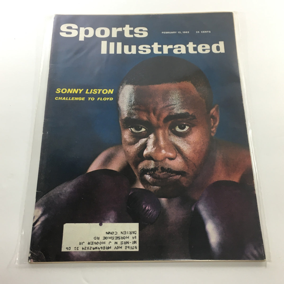 Cover of Sports Illustrated magazine from February 12, 1962, featuring Sonny Liston with the title 'Sonny Liston Challenge to Floyd'. The design highlights the iconic boxing moment with vivid colors, capturing Liston's intense gaze as he prepares for the challenge against Floyd Patterson.