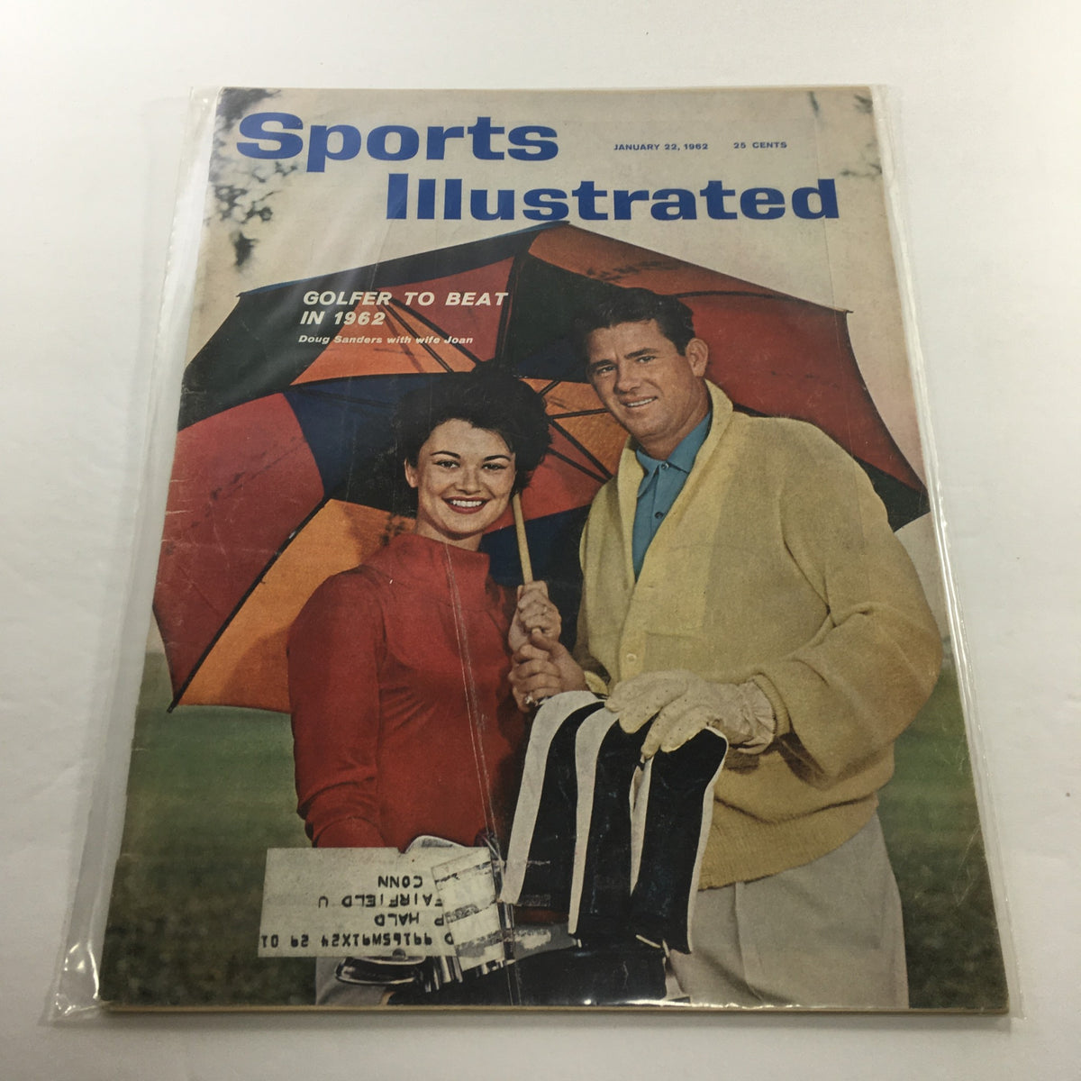 Sports Illustrated magazine cover from January 22, 1962 featuring golfer Doug Sanders with his wife Joan, showcasing their vibrant umbrellas. This vintage magazine highlights Sanders as the golfer to watch in 1962.