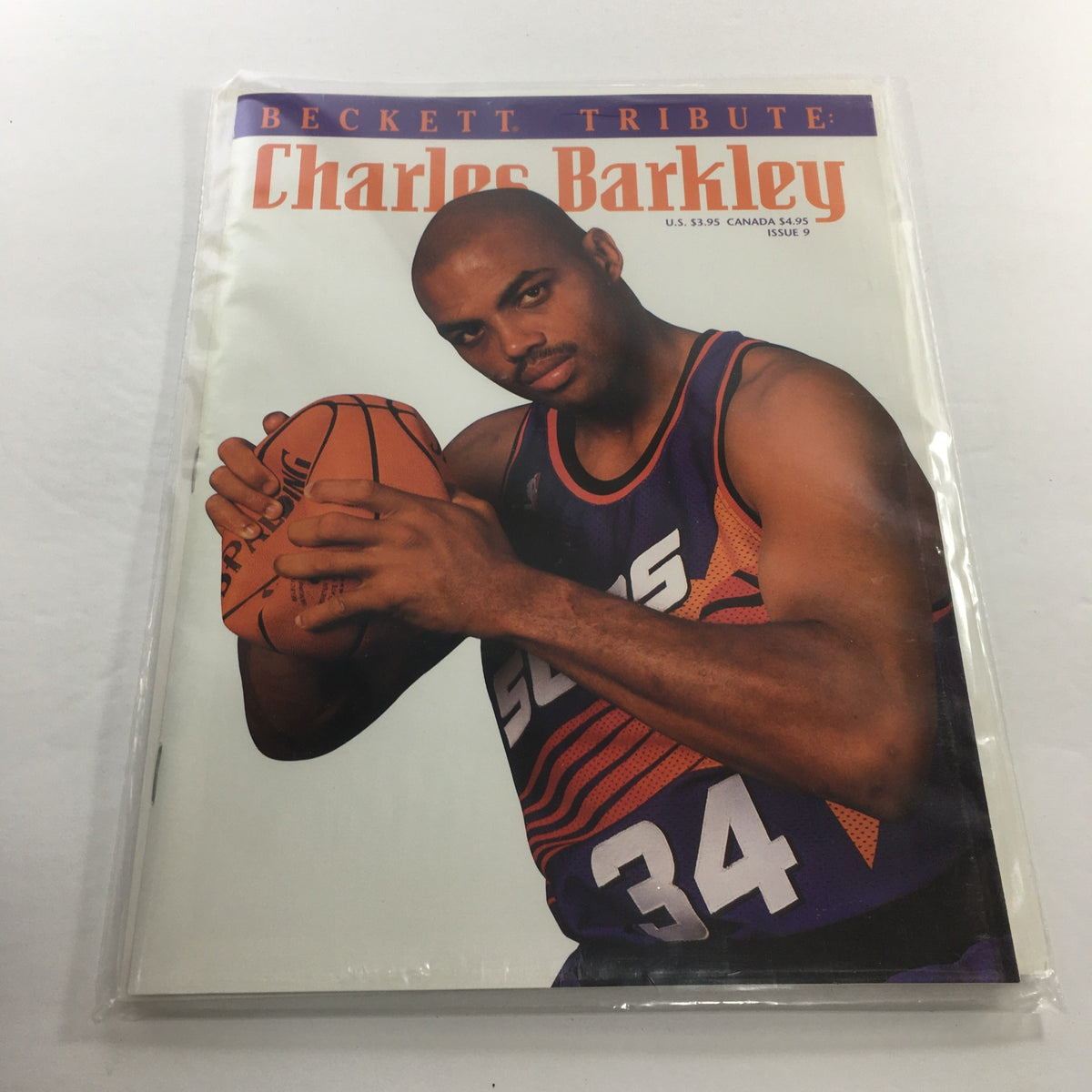 Beckett Tribute: 1994 Issue #9 featuring Charles Barkley on the cover, showcasing the legendary basketball player in a focused pose holding a basketball, in excellent condition and protective packaging.