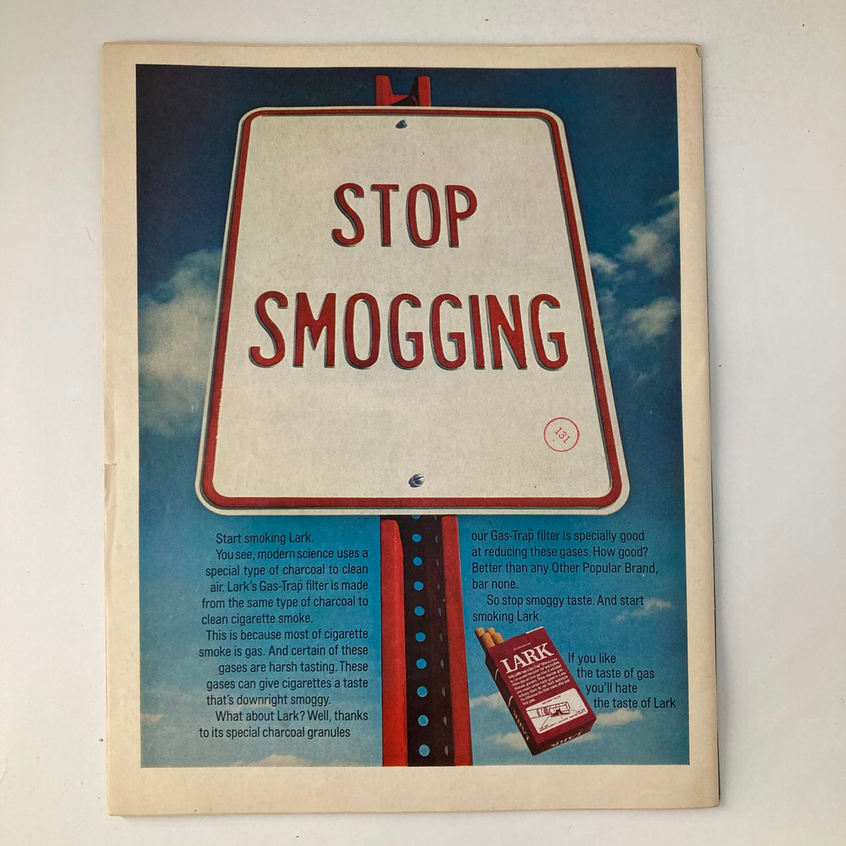 Advertisement page in VTG Life Magazine November 6 1970 displaying a vintage anti-smoking campaign with a creative 'Stop Smogging' sign and promoting Lark cigarettes.