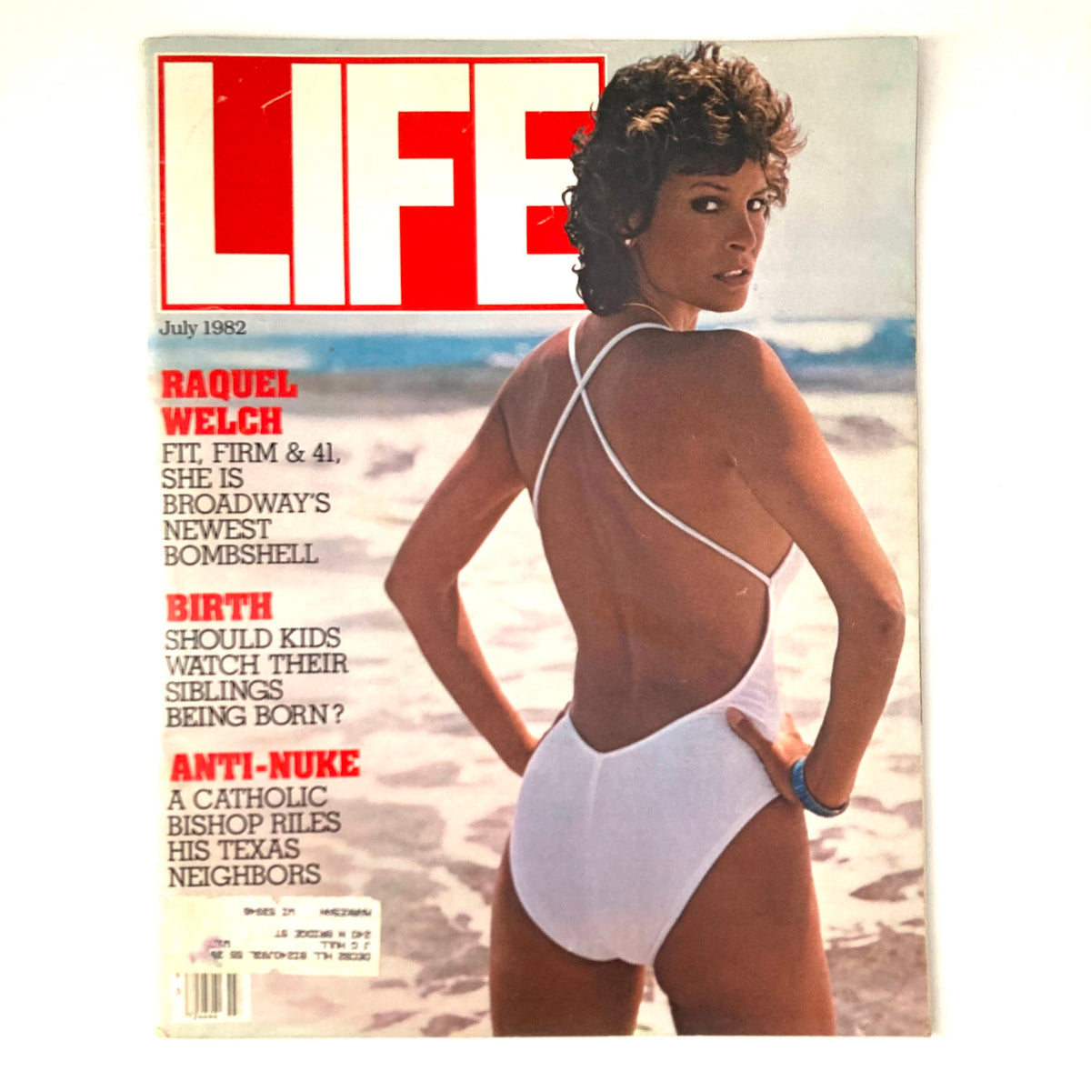 July 1982 Life Magazine featuring Raquel Welch, showcasing her on the beach in a white swimsuit, celebrated as Broadway's newest bombshell.