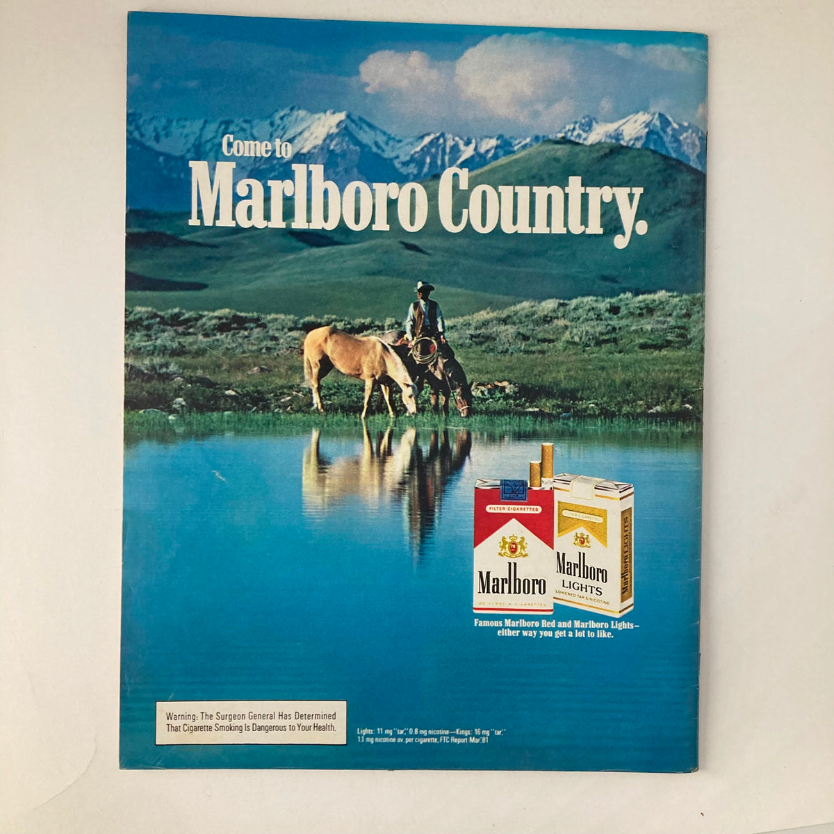 Vintage advertisement from VTG Life Magazine March 1982 promoting Marlboro cigarettes with scenic mountain backdrop and cowboy.
