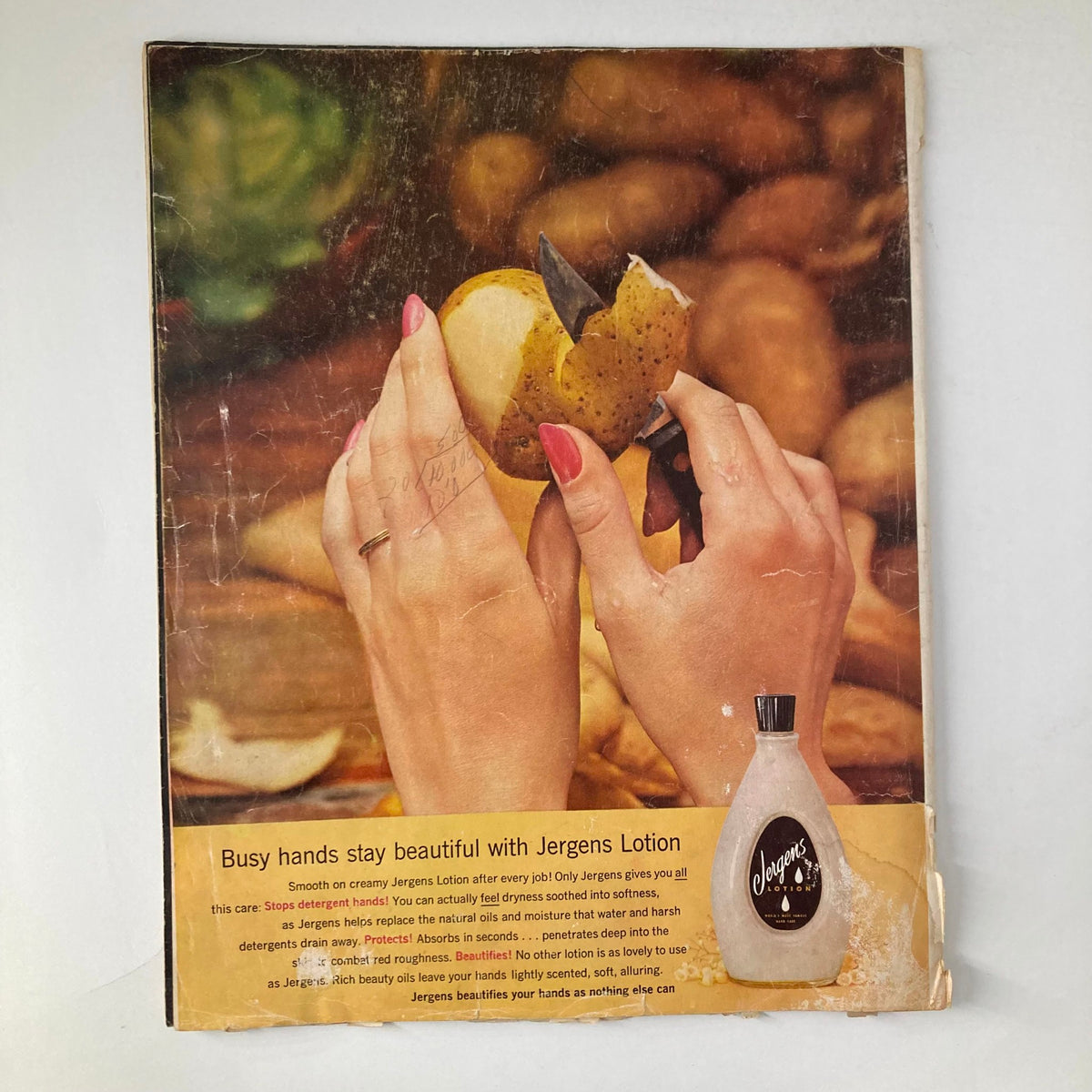 Back cover of Ladies' Home Journal Magazine February 1962 showcasing an advertisement for Jergens Lotion, emphasizing beauty and care for busy hands.