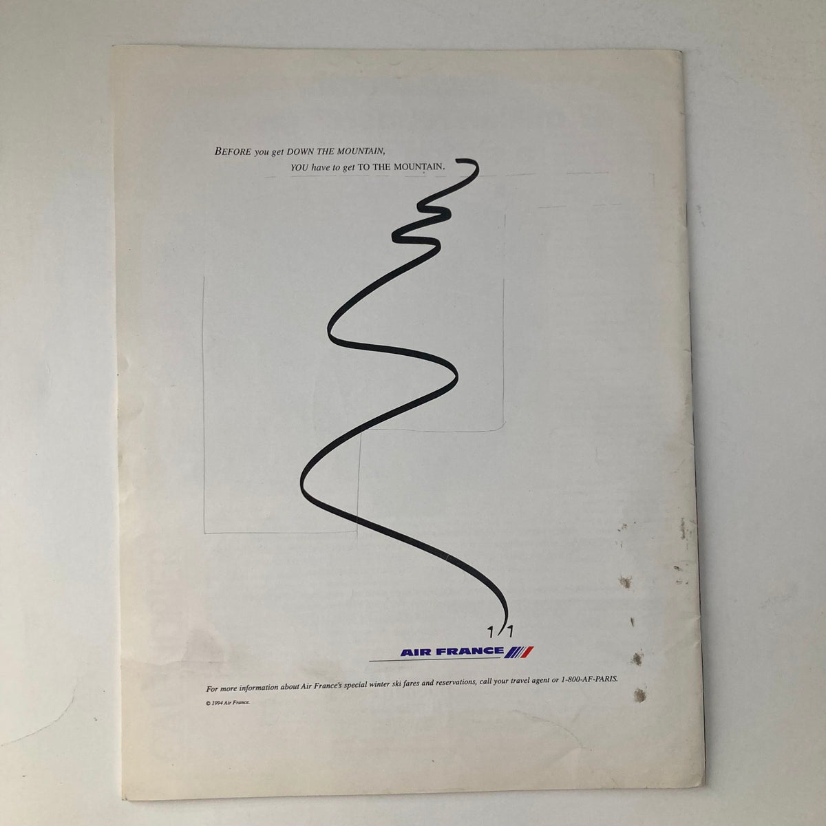 Cover page of France Magazine Winter 1994 No. 33 featuring a minimalist design with a wavy line and a quote about reaching the mountain, promoting Air France's winter ski fares.