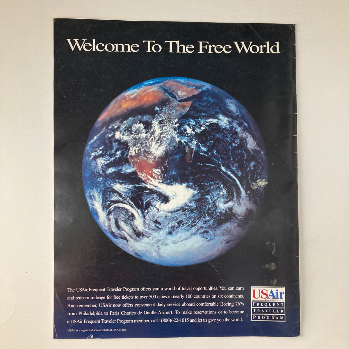 Back cover of France Magazine Winter 1995 No. 37 with an advertisement for USAir's Frequent Traveler Program, promoting travel opportunities.