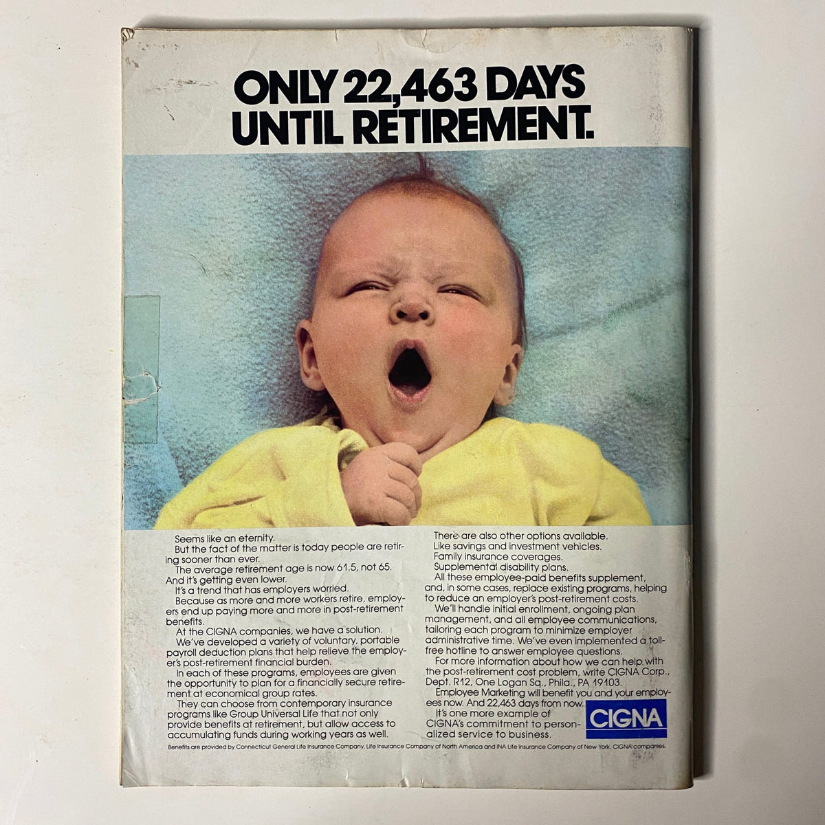 Back cover of Forbes Magazine April 6, 1987 with a humorous advertisement stating 'Only 22,463 Days Until Retirement'.