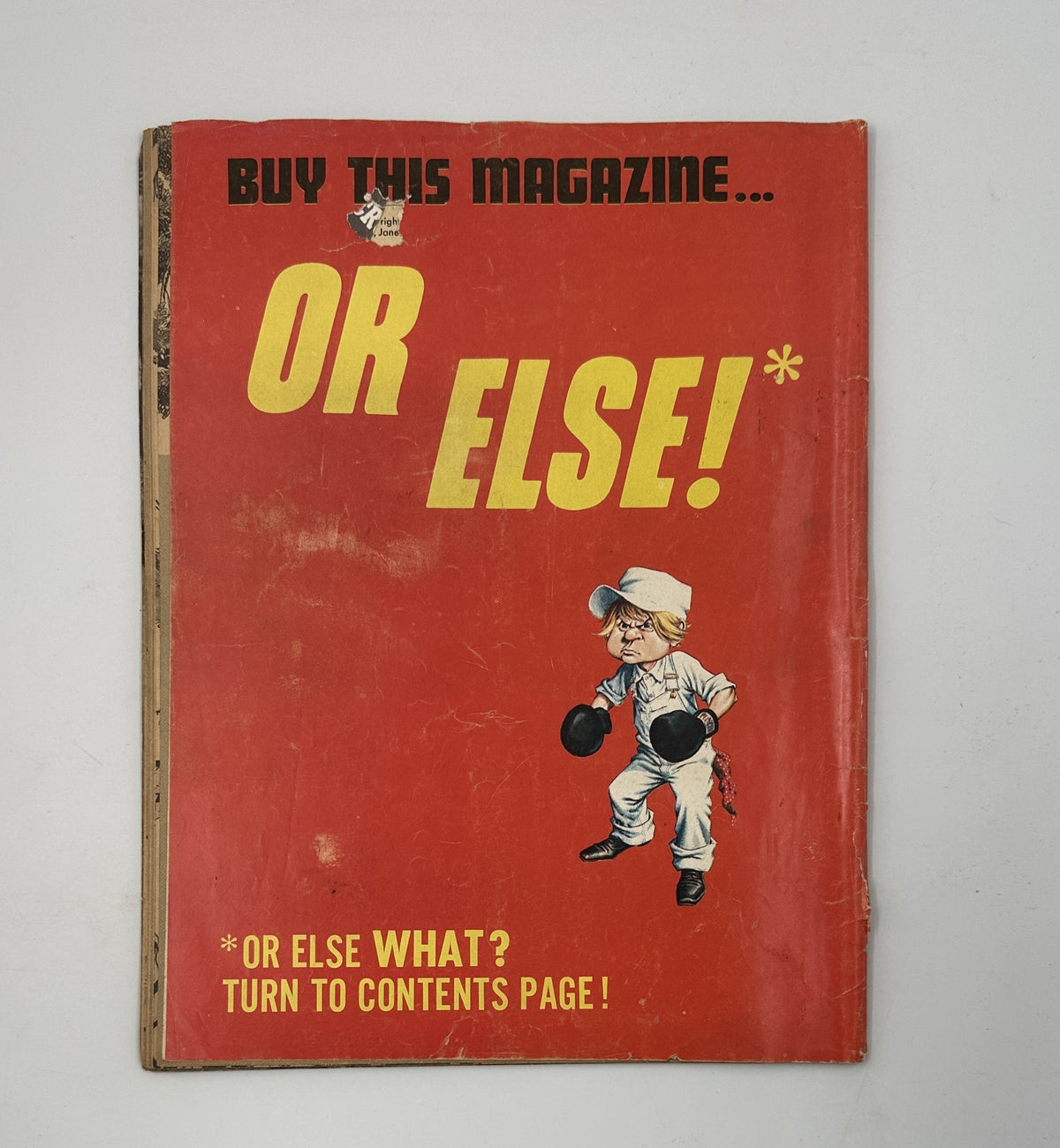 Back cover of Cracked Magazine No. 60 May 1967 featuring the playful phrase 'BUY THIS MAGAZINE... OR ELSE!' along with an illustration, promoting the humor and style of the publication.