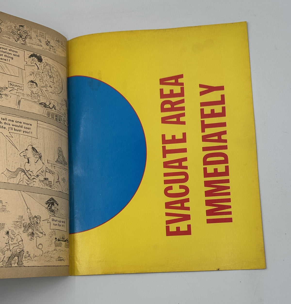 Page from Cracked Magazine No. 160 July 1979 featuring the text 'EVACUATE AREA IMMEDIATELY' with colorful background and comedic elements.