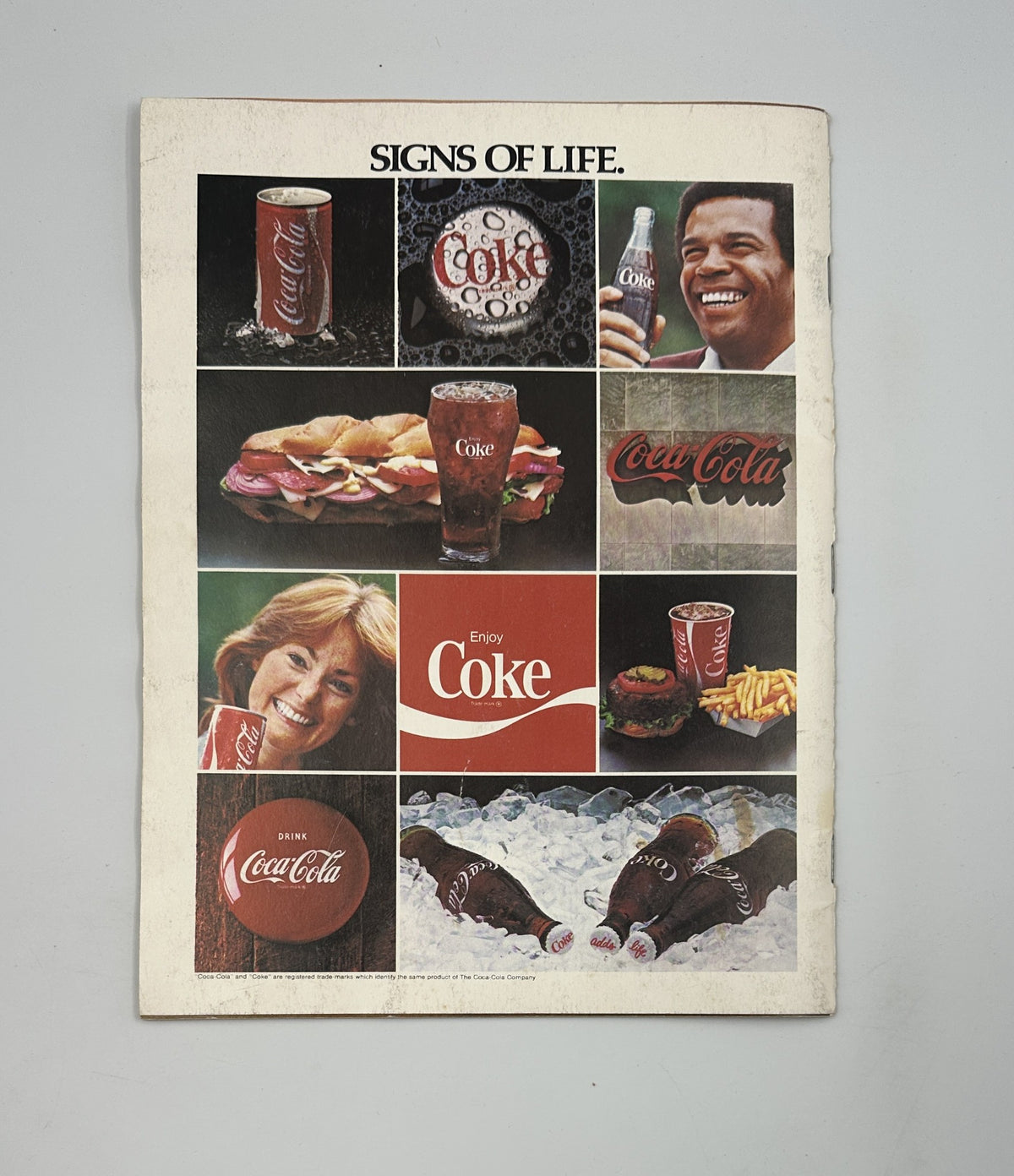 Harlem Globetrotters Magazine On Tour Basketball Team Photos displaying a vintage Coca-Cola advertisement with various products and joyful moments.