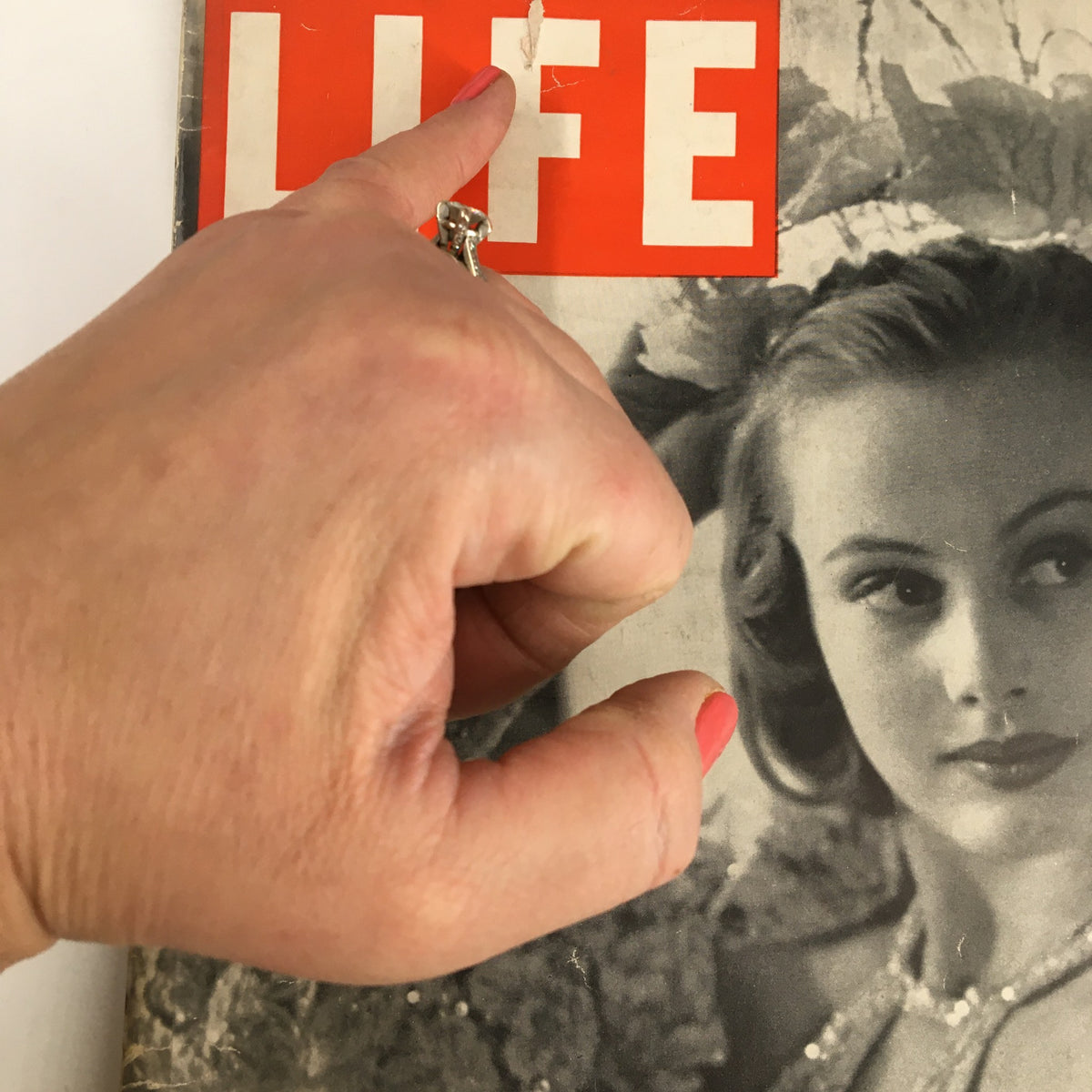 Close-up of the cover of VTG Life Magazine December 20, 1937, highlighting a tear and beauty of the vintage photography.
