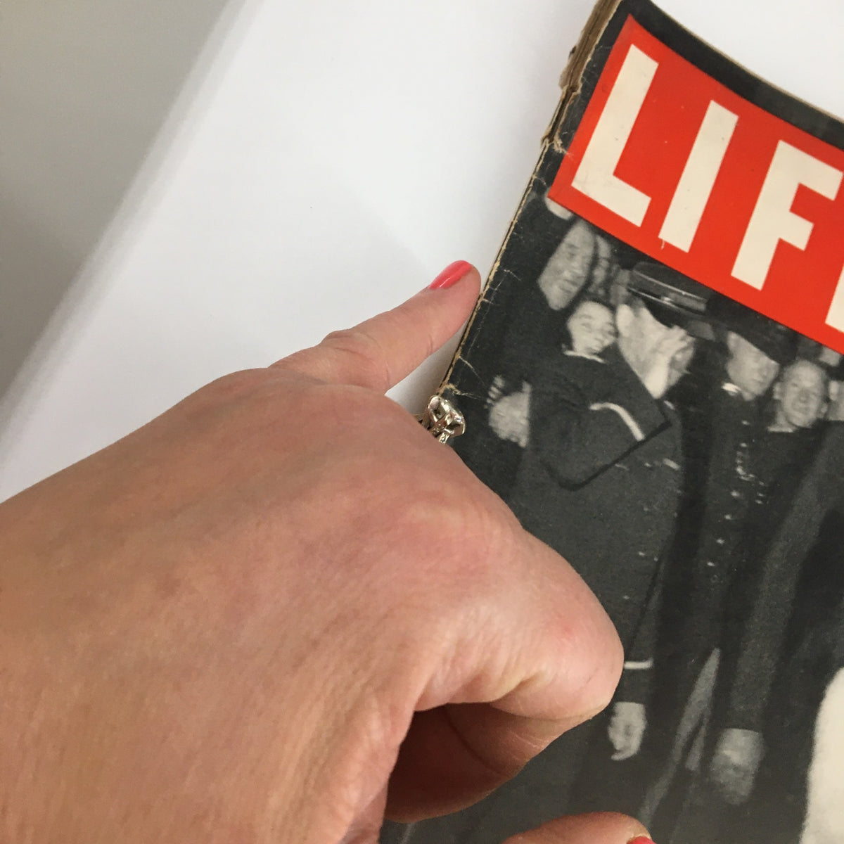 Close-up of the side view of Life Magazine cover dated July 25, 1938, highlighting the details of Elizabeth Roosevelt's attire.