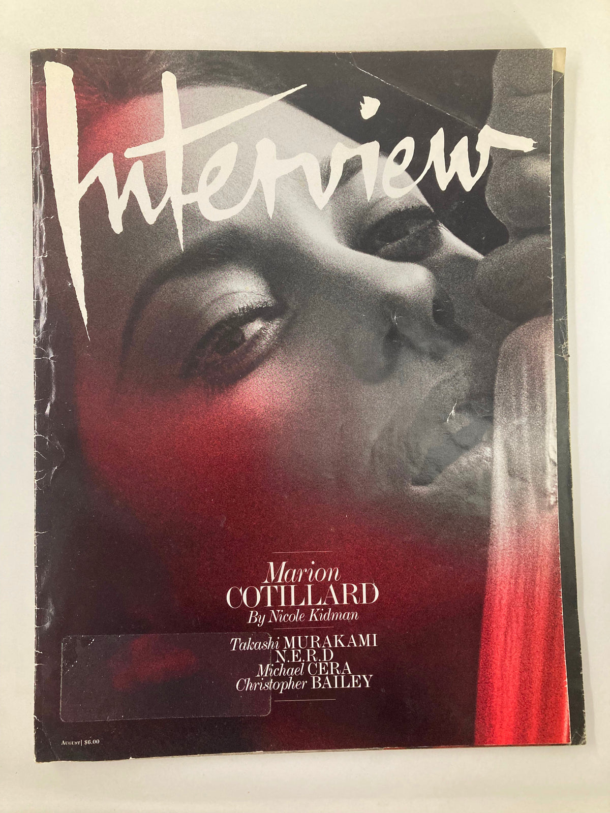 Cover of Interview Magazine August 2010 featuring Marion Cotillard, photographed by Nicole Kidman. The visually striking design highlights Cotillard's captivating features, symbolizing her rise in Hollywood during that era.