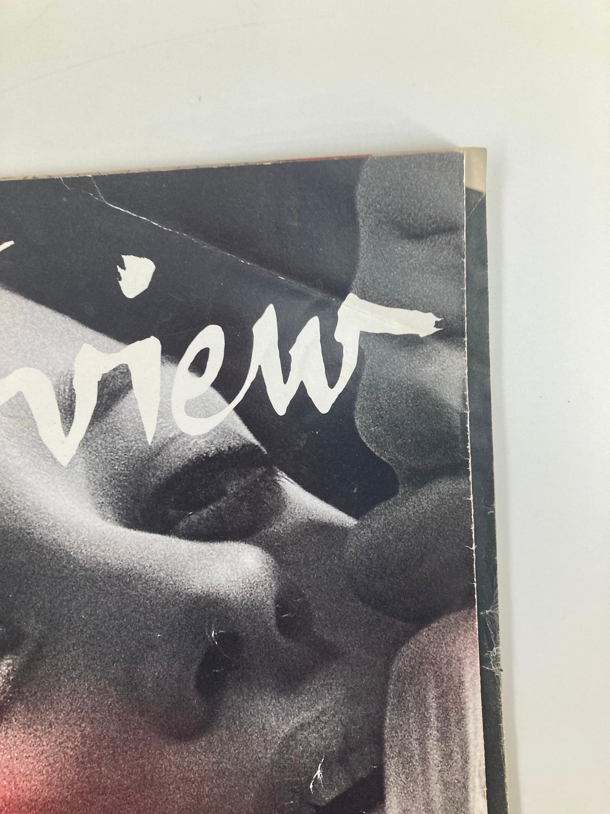 Detailed view of the cover page of Interview Magazine August 2010, highlighting the artistic design and intriguing typography, featuring Marion Cotillard.
