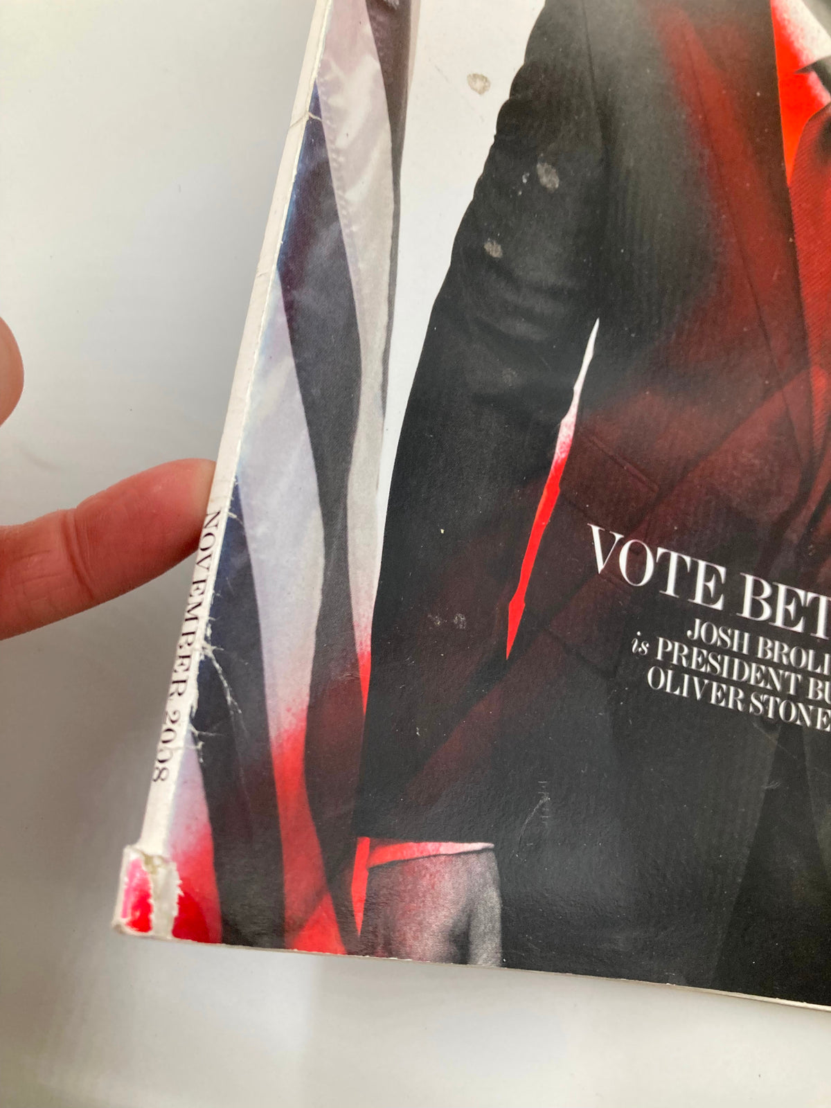 Side view of Interview Magazine November 2008 showing the deteriorated spine and minor wear, visual details reflecting its vintage condition.