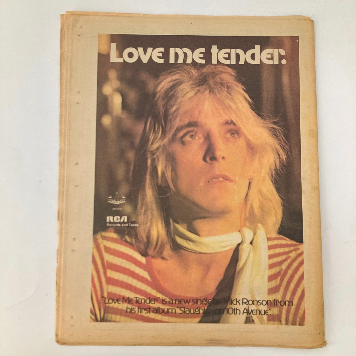 Cover of Rolling Stone Magazine March 28 1974 featuring an advertisement for Rick Ronson's single 'Love Me Tender' along with an image of the artist with long hair, highlighting the vintage aesthetic of the magazine.