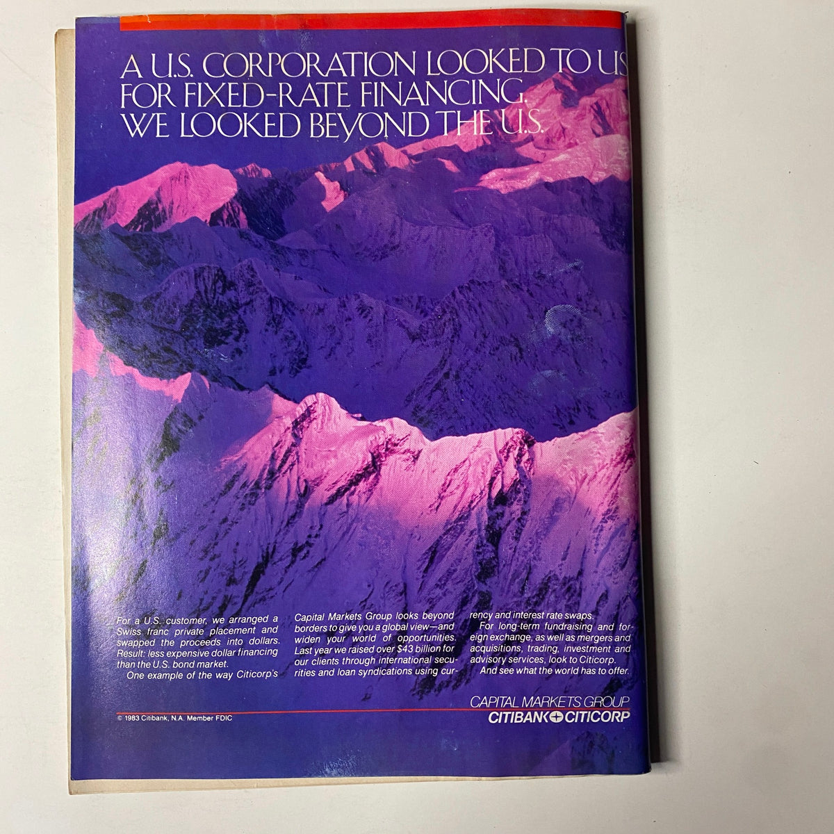 Back cover of Forbes Magazine from March 28, 1983, featuring an eye-catching image of mountains with text discussing fixed-rate financing and global opportunities, reflecting the magazine's themes of finance and international business.