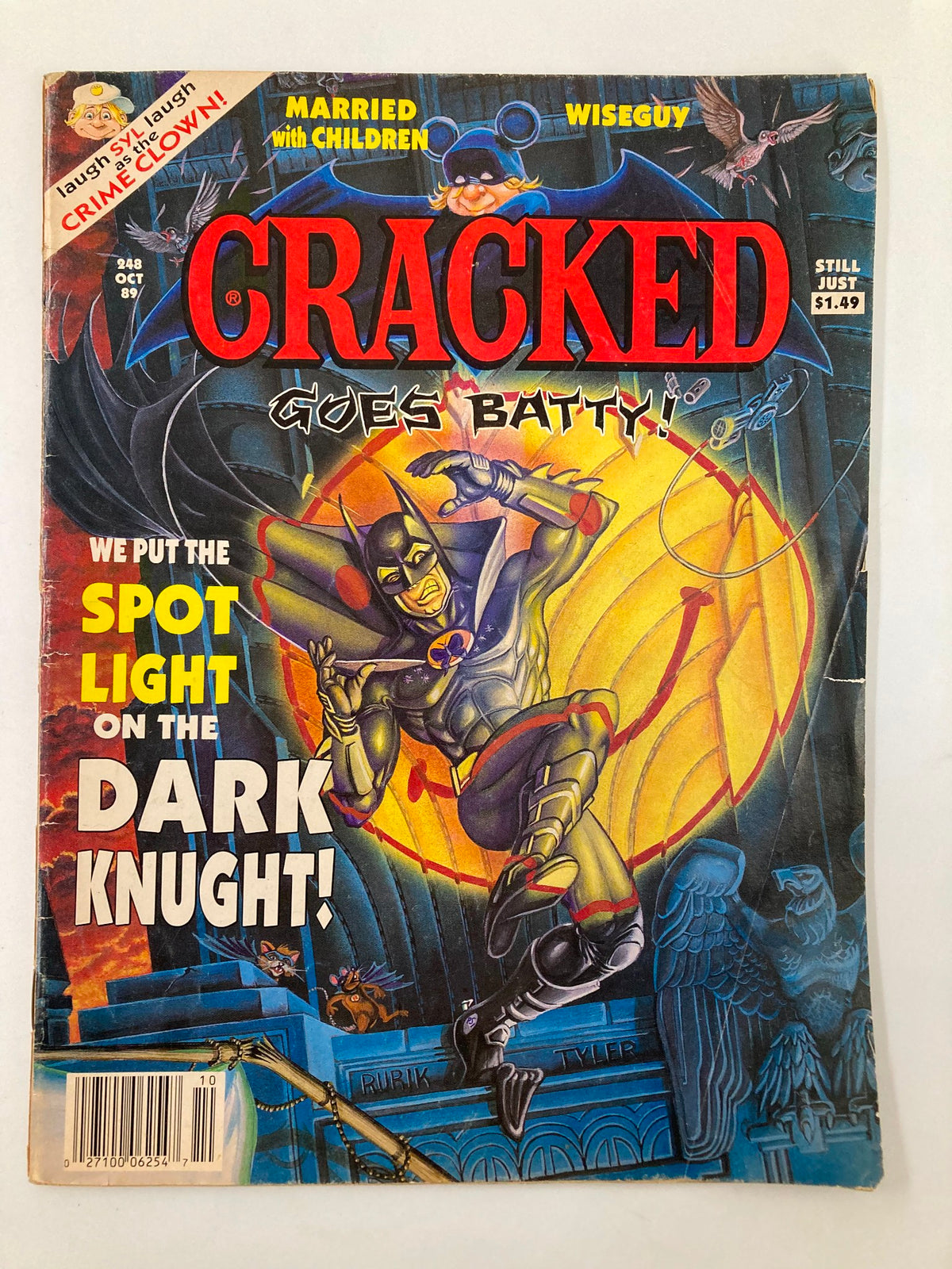 Cracked Humor Magazine October 1989 cover featuring a spot light on The Dark Knight, with colorful illustrations and humor-themed graphics.