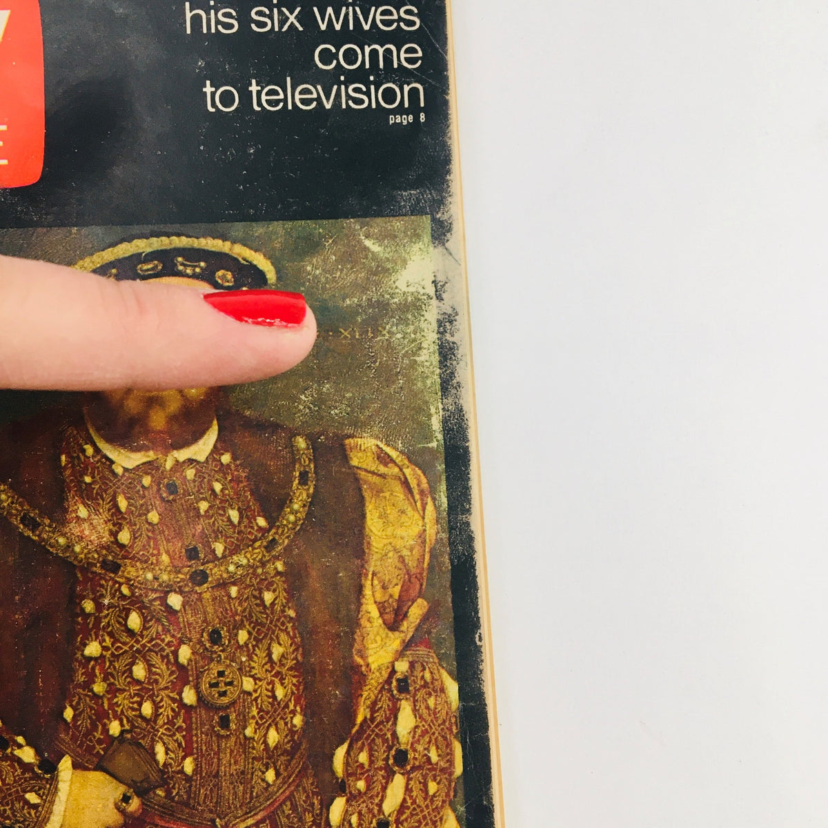 Close-up of the TV Guide July 31 1971 #957 cover showing Henry VIII and His Six Wives with a red nail highlighting the magazine.