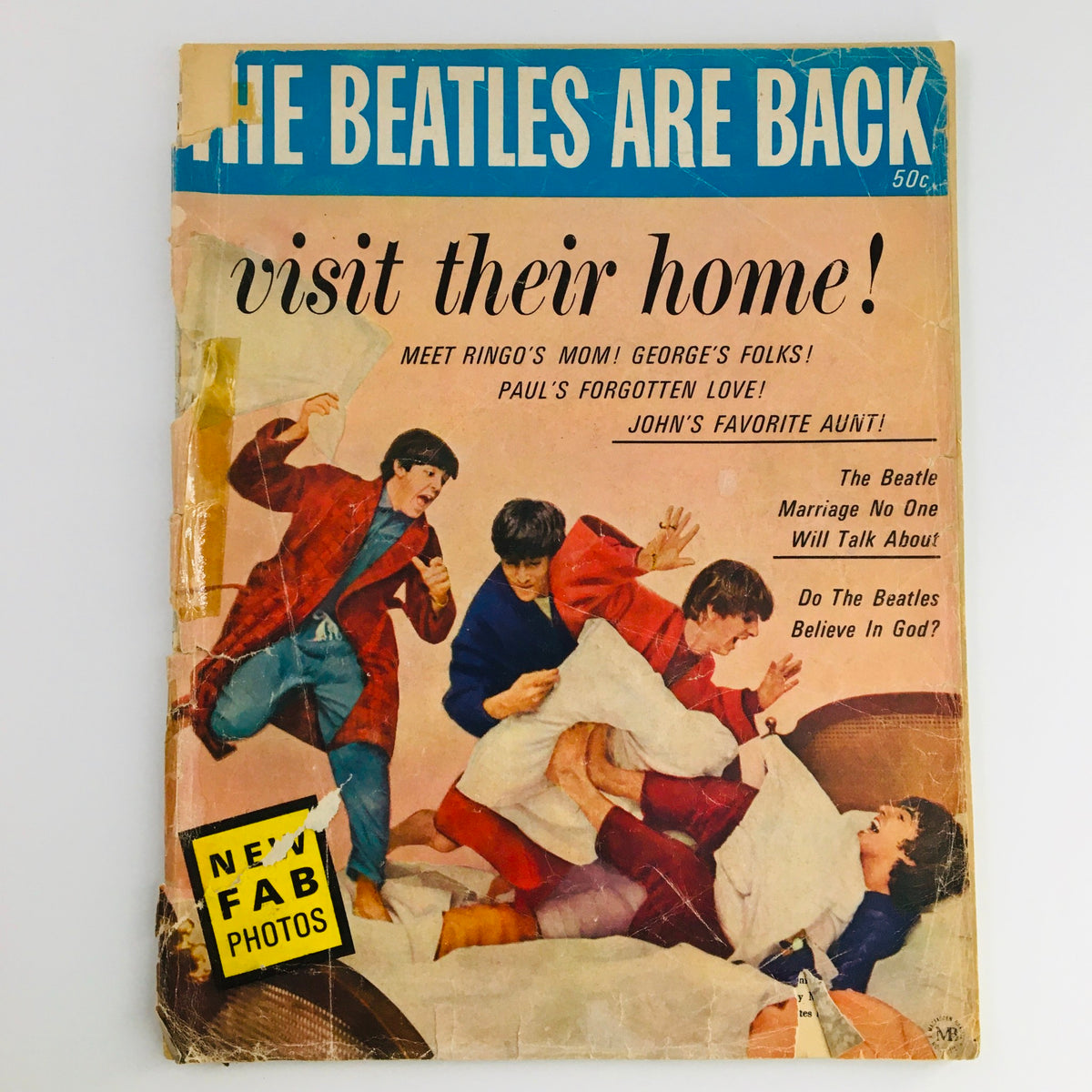 1964 The Beatles Are Back and Visit Their Home Fab Photos magazine cover featuring the iconic band engaging in playful antics, showcasing their vibrant personality and connection with fans.