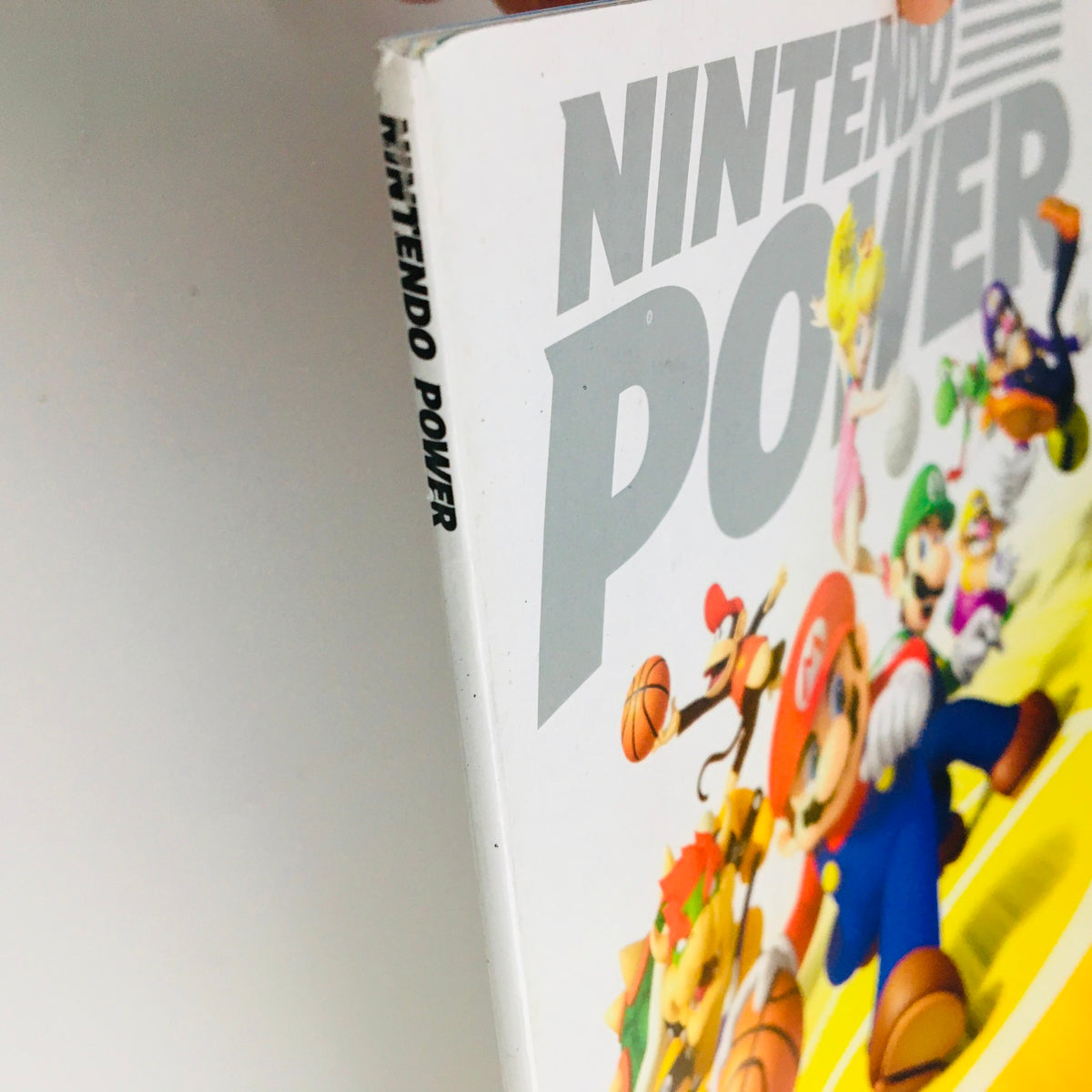 Side view of Nintendo Power Magazine January 2011, displaying the magazine title 'Nintendo Power' and part of the cover design.