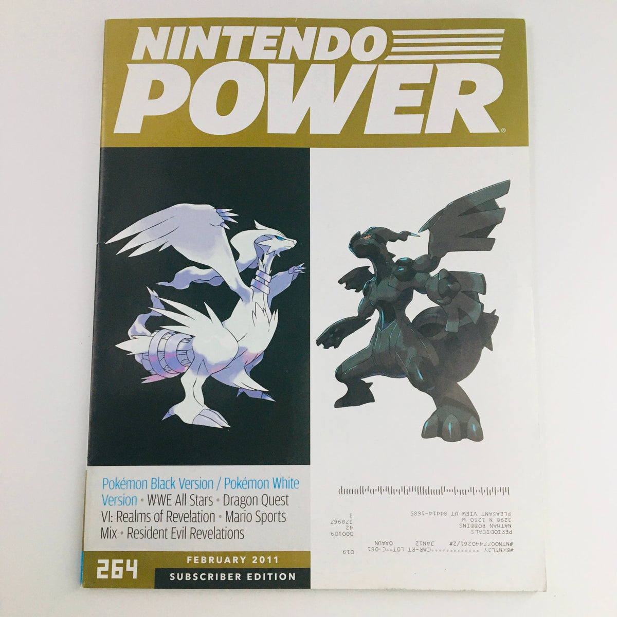 Nintendo Power Magazine February 2011 featuring Pokémon Black Version & White Version on the cover, showcasing iconic characters Reshiram and Zekrom.