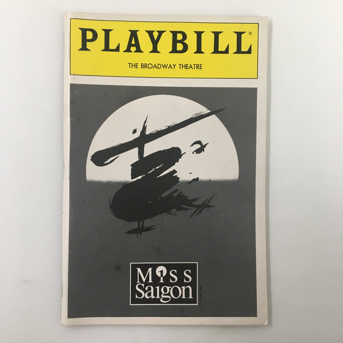 1991 Playbill for the Broadway production of Miss Saigon, featuring iconic cover art depicting a helicopter silhouette and theatre logo.