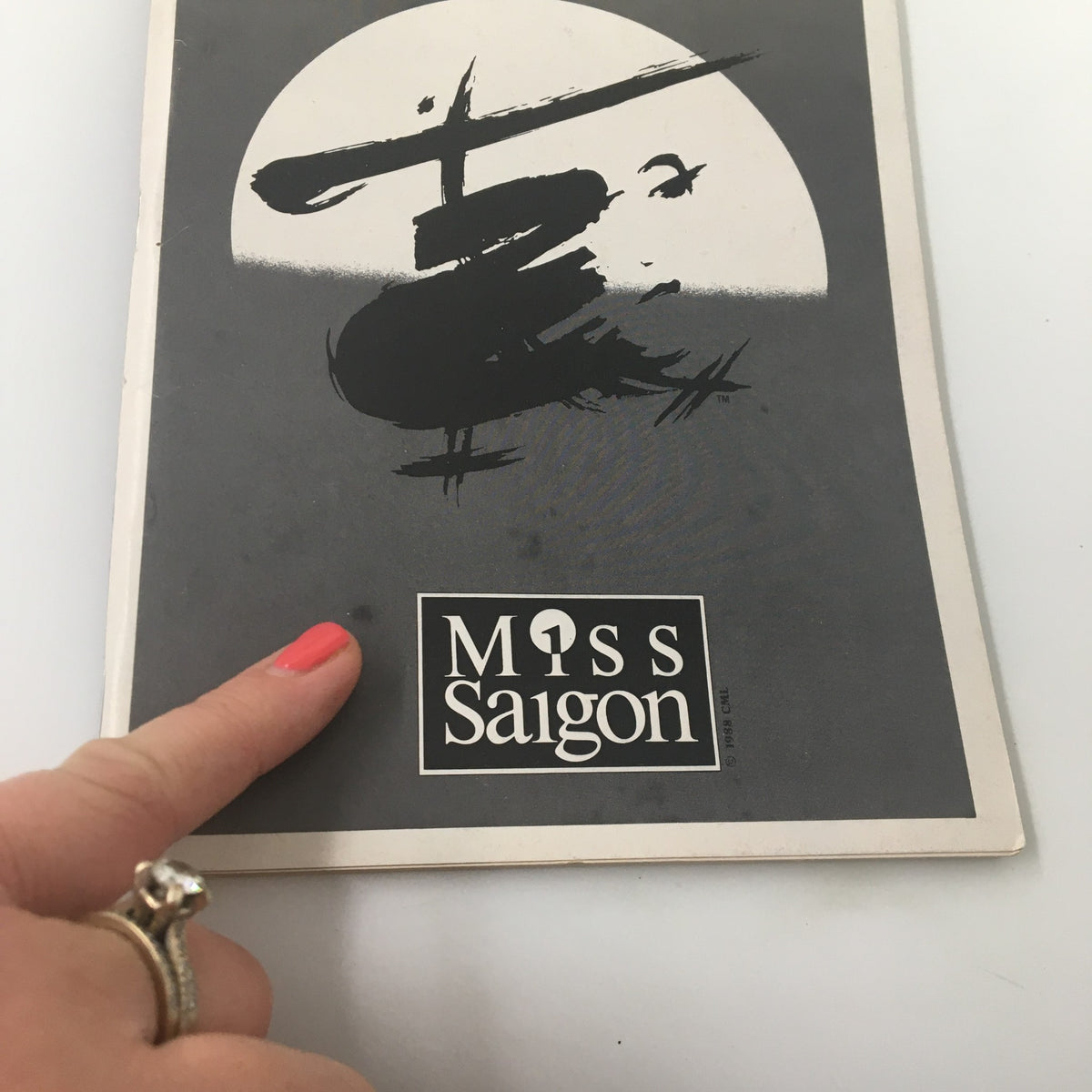 Cover of the 1991 Playbill for Miss Saigon, showcasing bold artwork and the show's title.