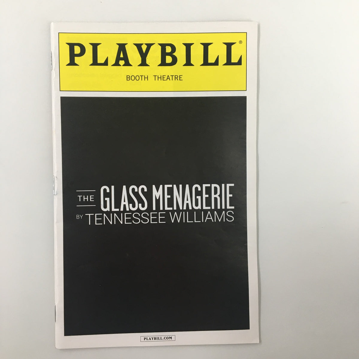 2014 Playbill for The Glass Menagerie by Tennessee Williams at the Booth Theatre, showcasing the iconic cover design featuring the title prominently.