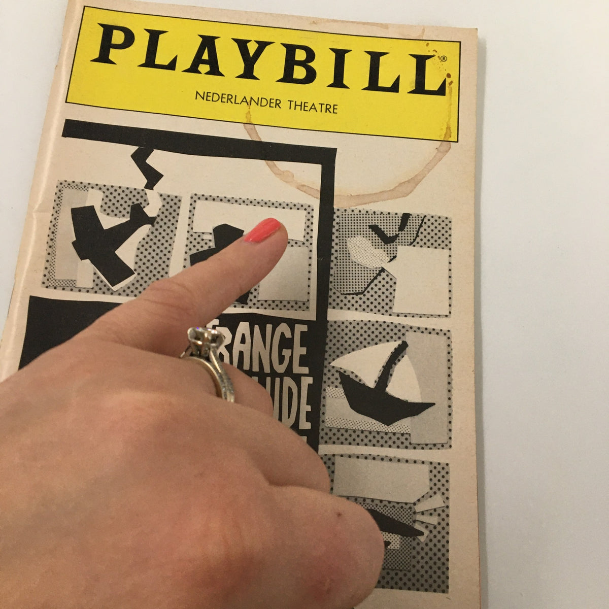 1985 Playbill Nederlander Theatre Glenda Jackson Strange Interlude with a hand pointing at the cover design.