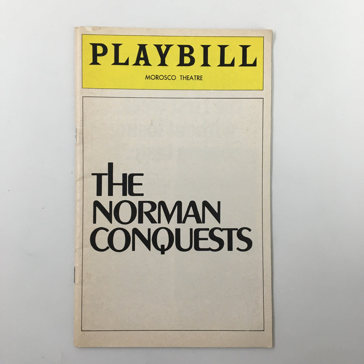 Front cover of the 1976 Playbill for The Norman Conquests at the Morosco Theatre, showcasing the title in bold typography.