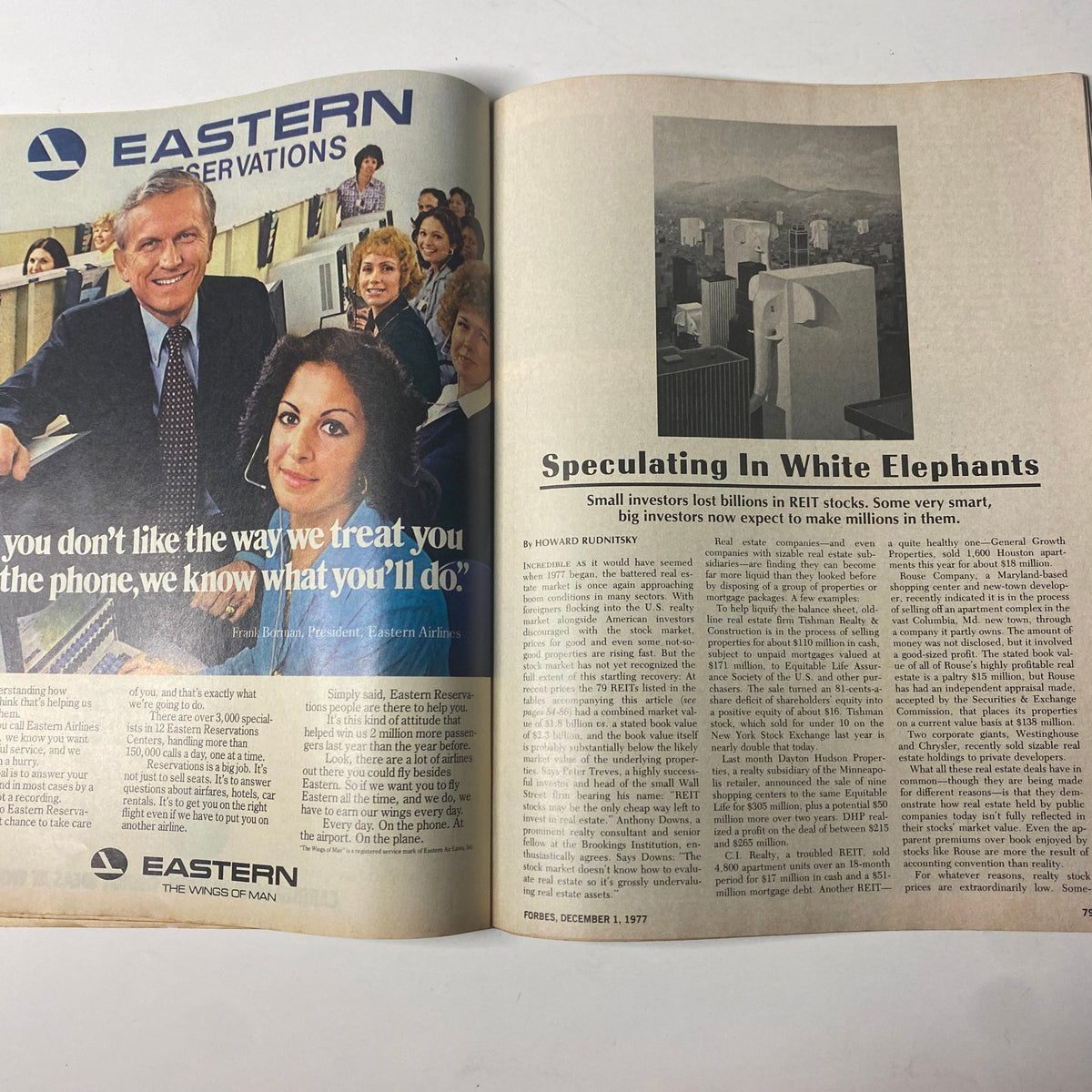 Spread from Forbes Magazine December 1, 1977 featuring an advertisement for Eastern Airlines alongside an article titled 'Speculating In White Elephants' discussing REIT investment strategies.