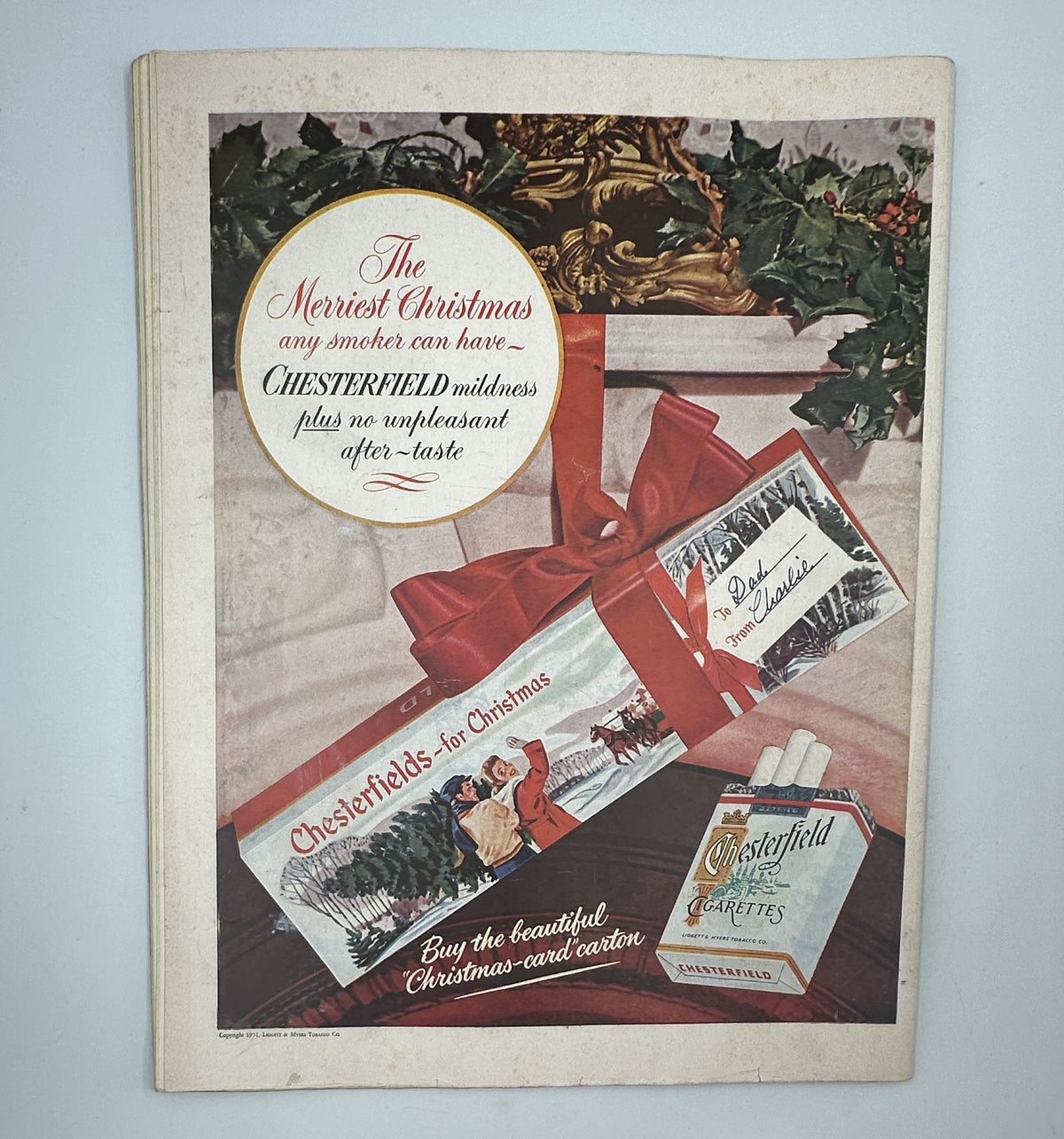Collier’s Magazine December 8, 1951 cover with a Christmas-themed advertisement for Chesterfield cigarettes, emphasizing the holiday season and product presentation.